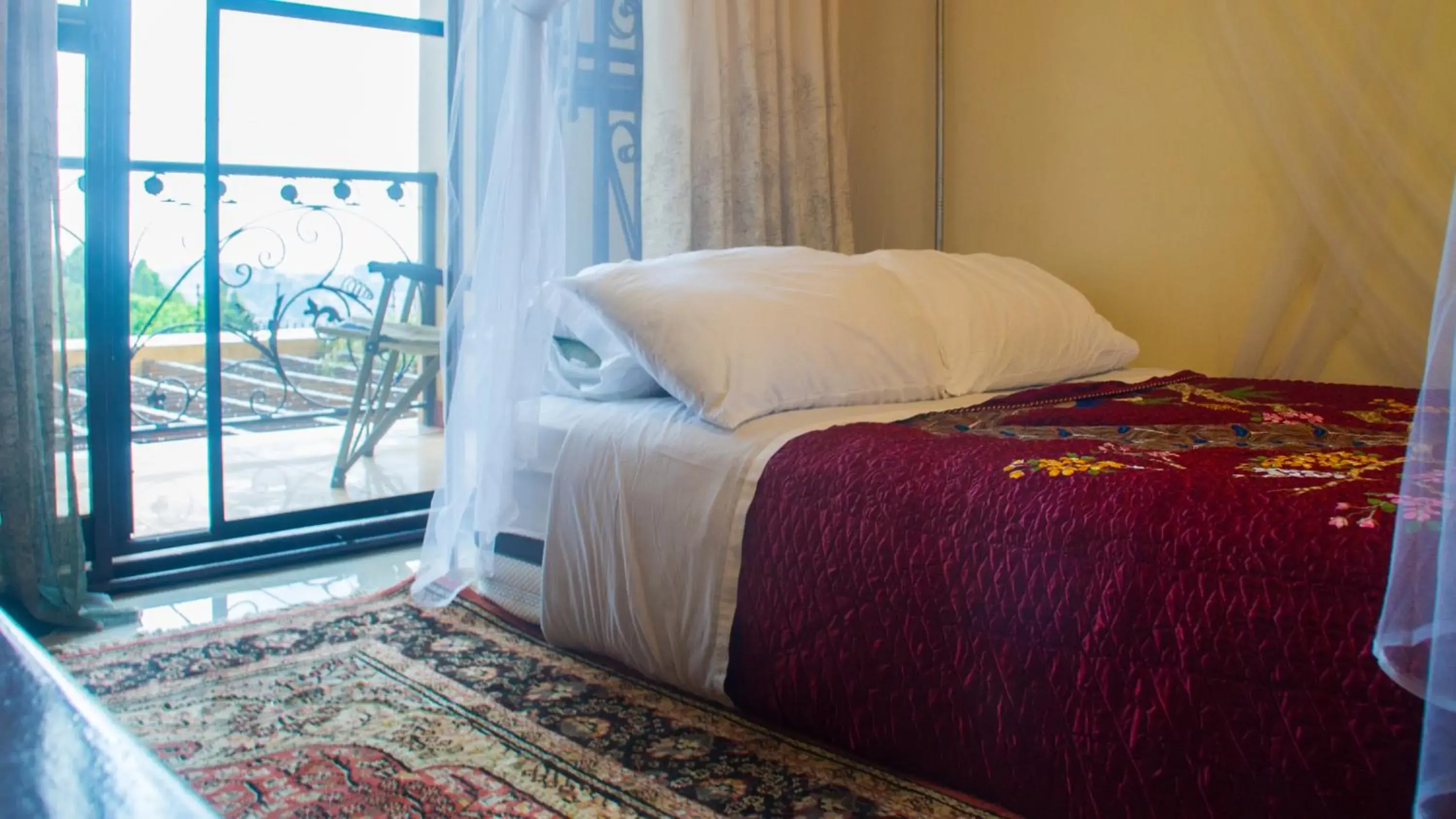 Bed in Bona Safari Villa Bunamwaya Bed in Bona Safari Villa Bunamwaya