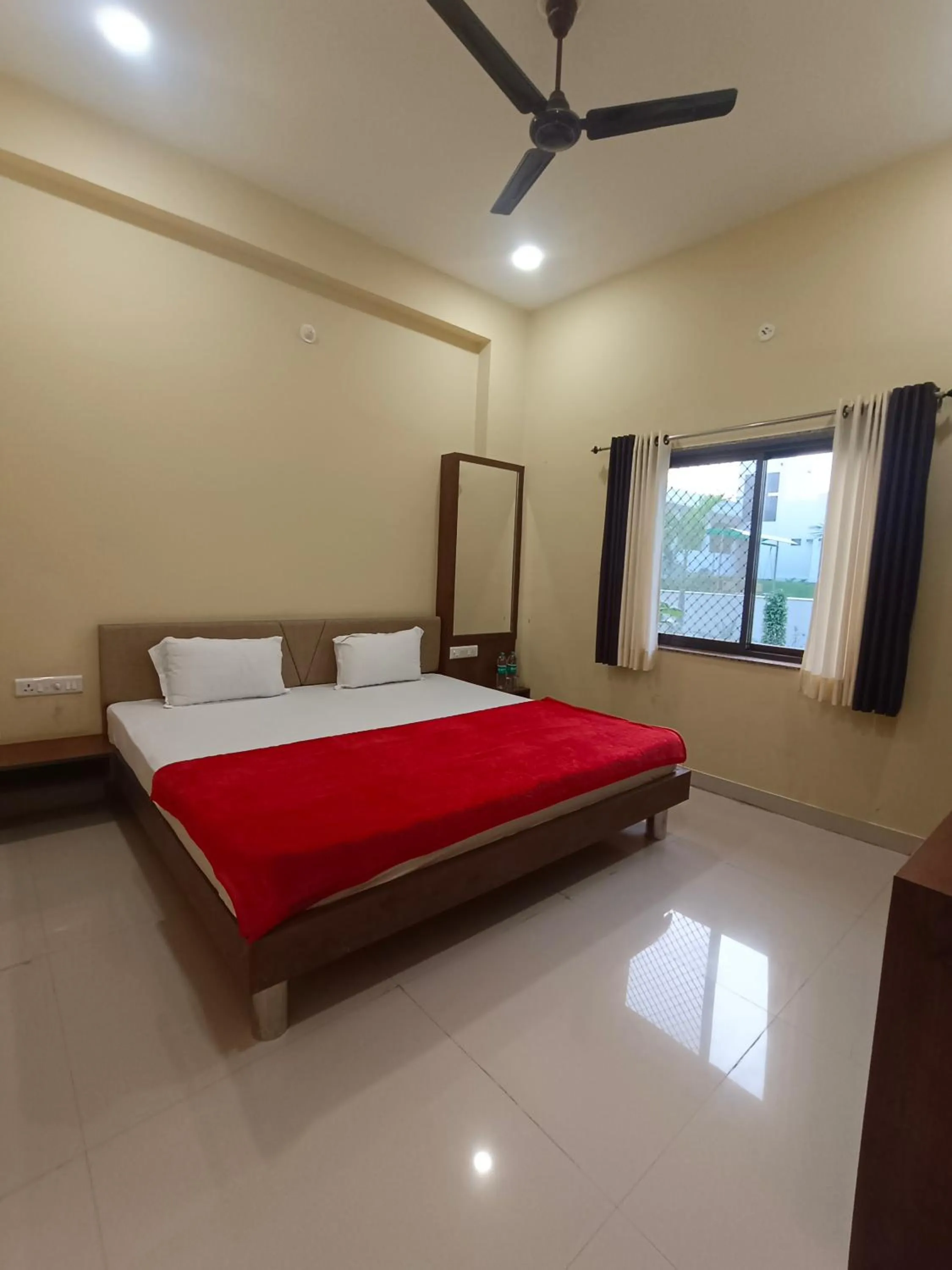 Bed in Vijayam Resort