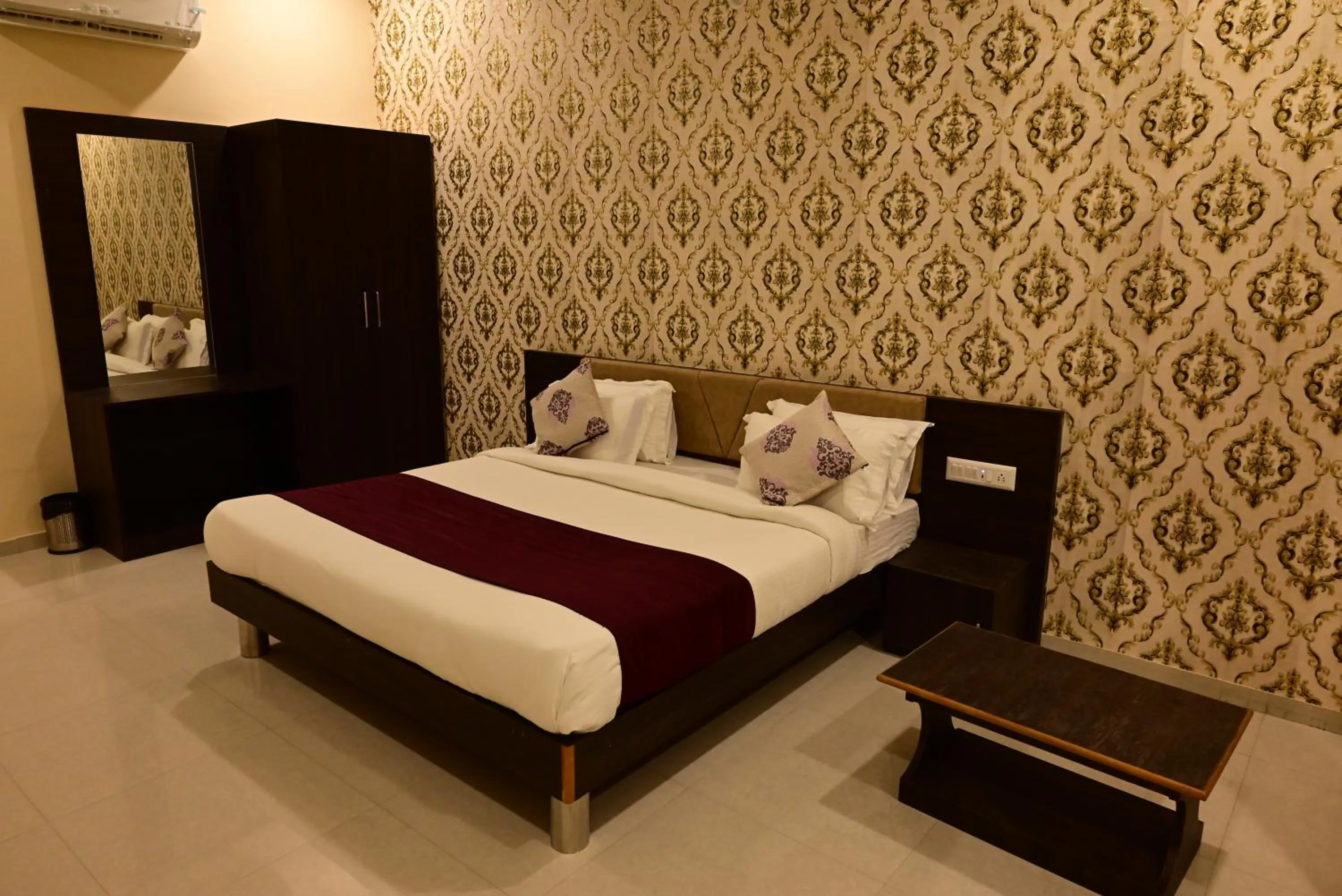 Bed in Vijayam Resort