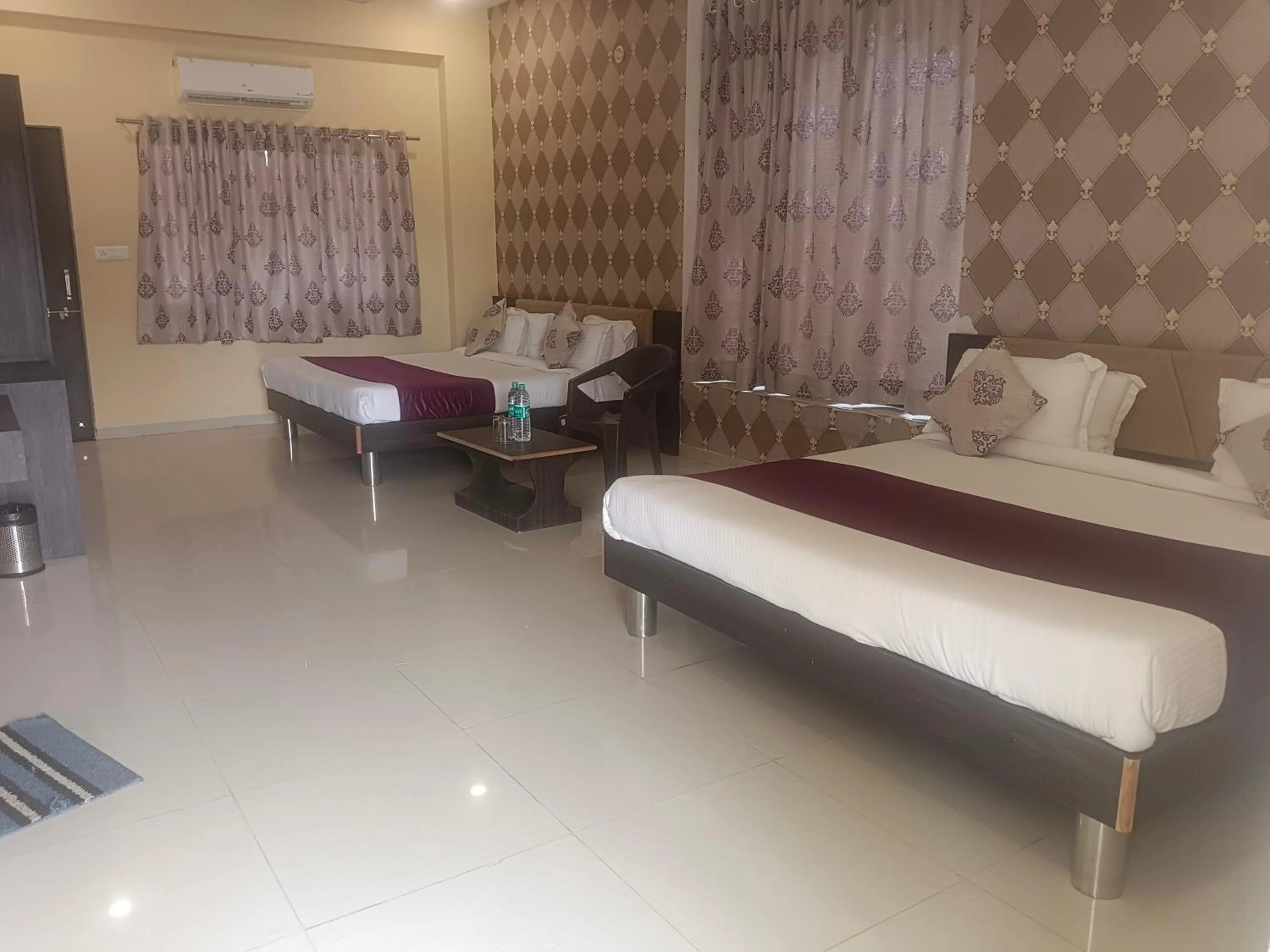 Bed in Vijayam Resort