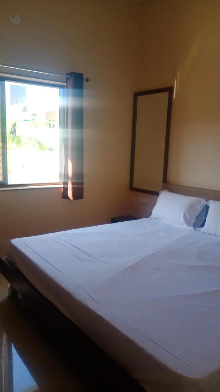 Bed in Vijayam Resort