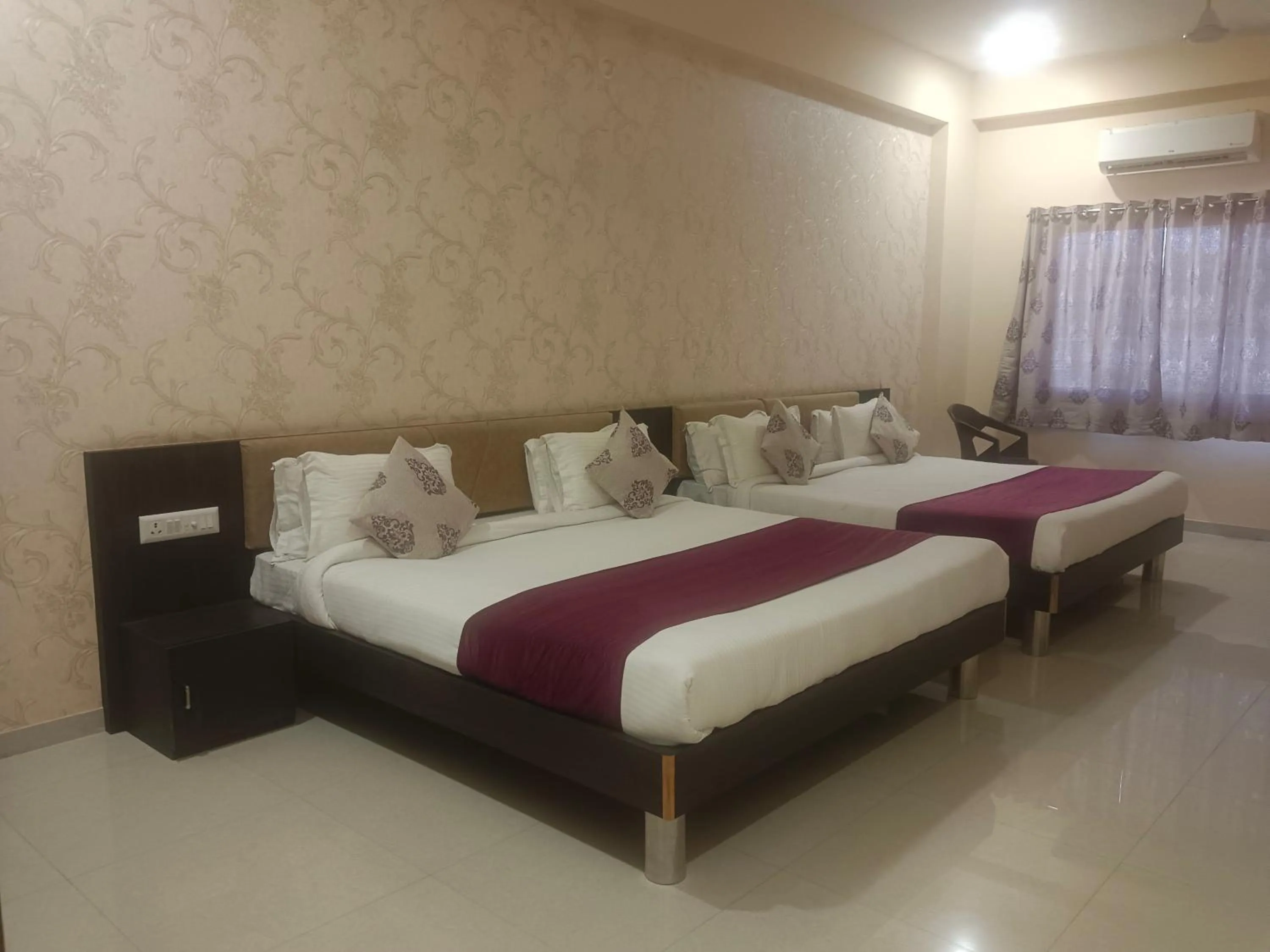 Bed in Vijayam Resort
