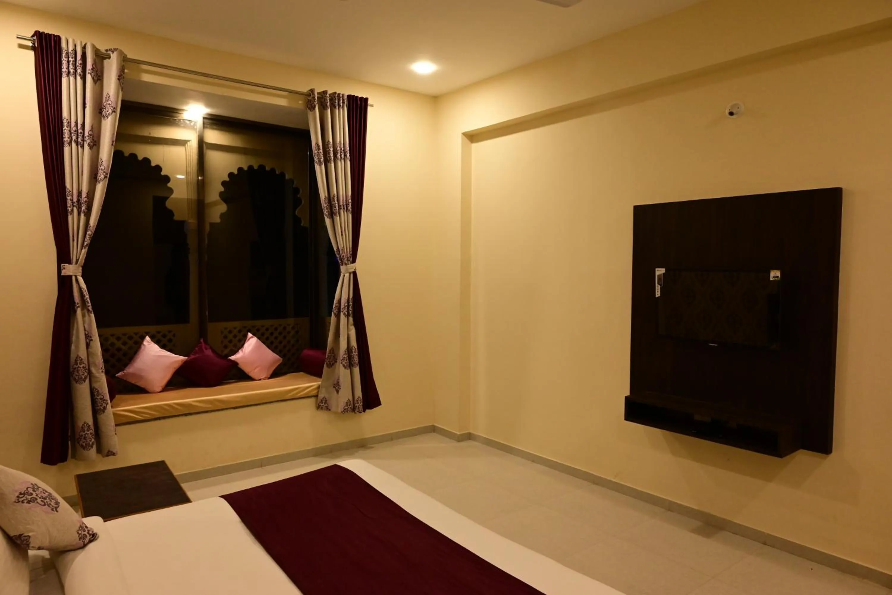 Bed in Vijayam Resort