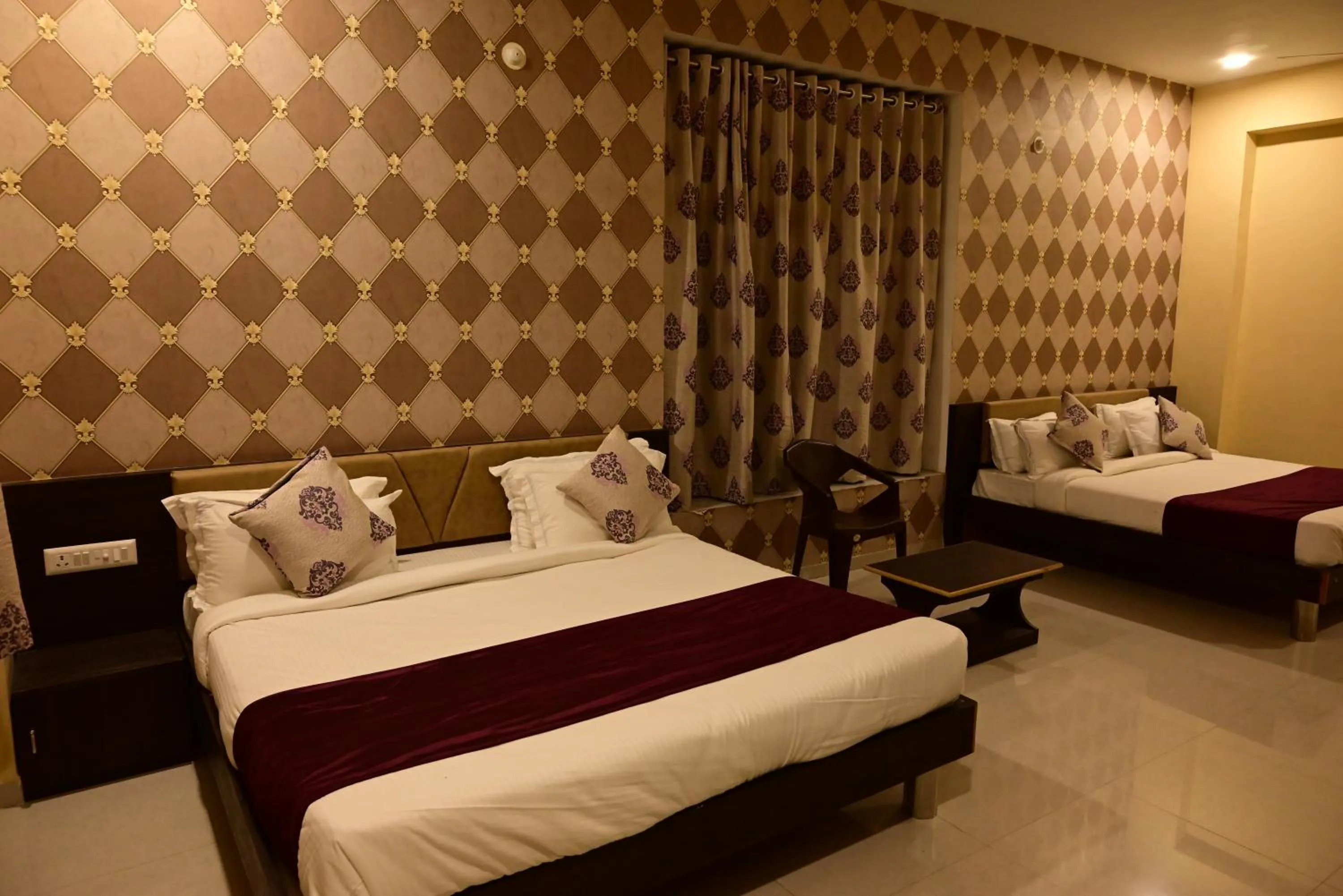 Bed in Vijayam Resort