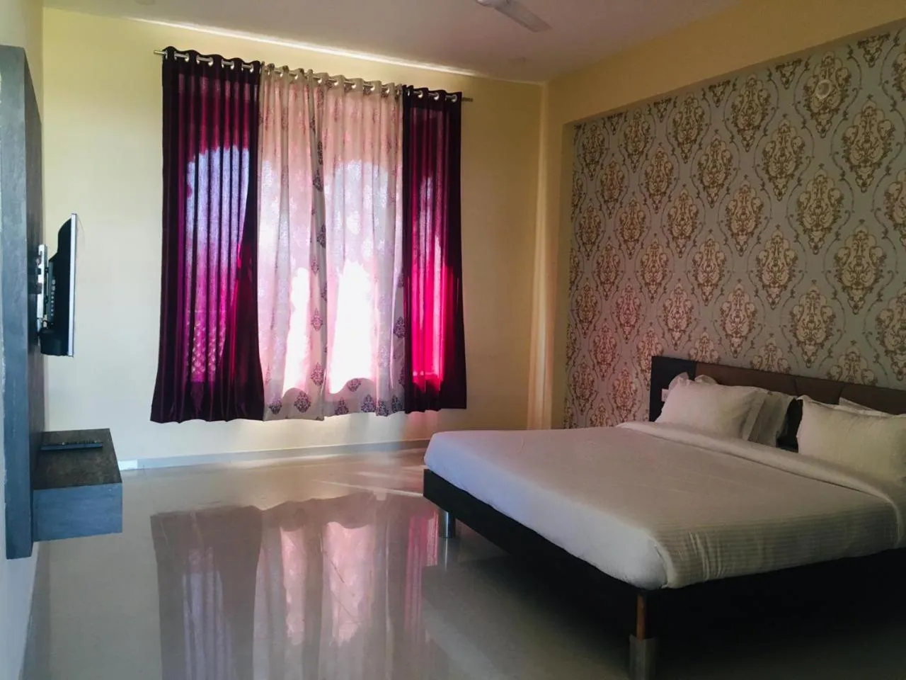Bed in Vijayam Resort