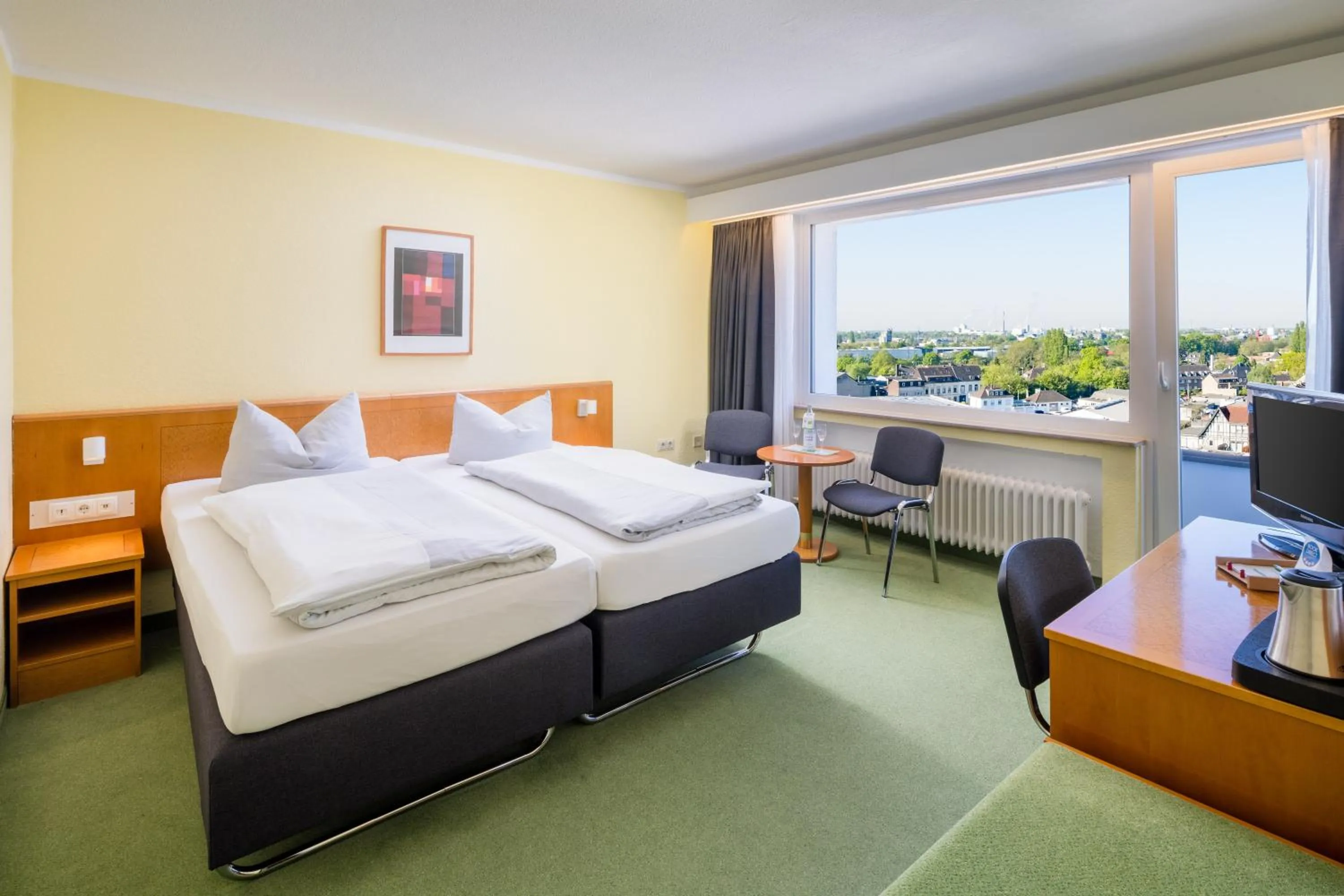Photo of the whole room, Bed in Garden Hotel Krefeld