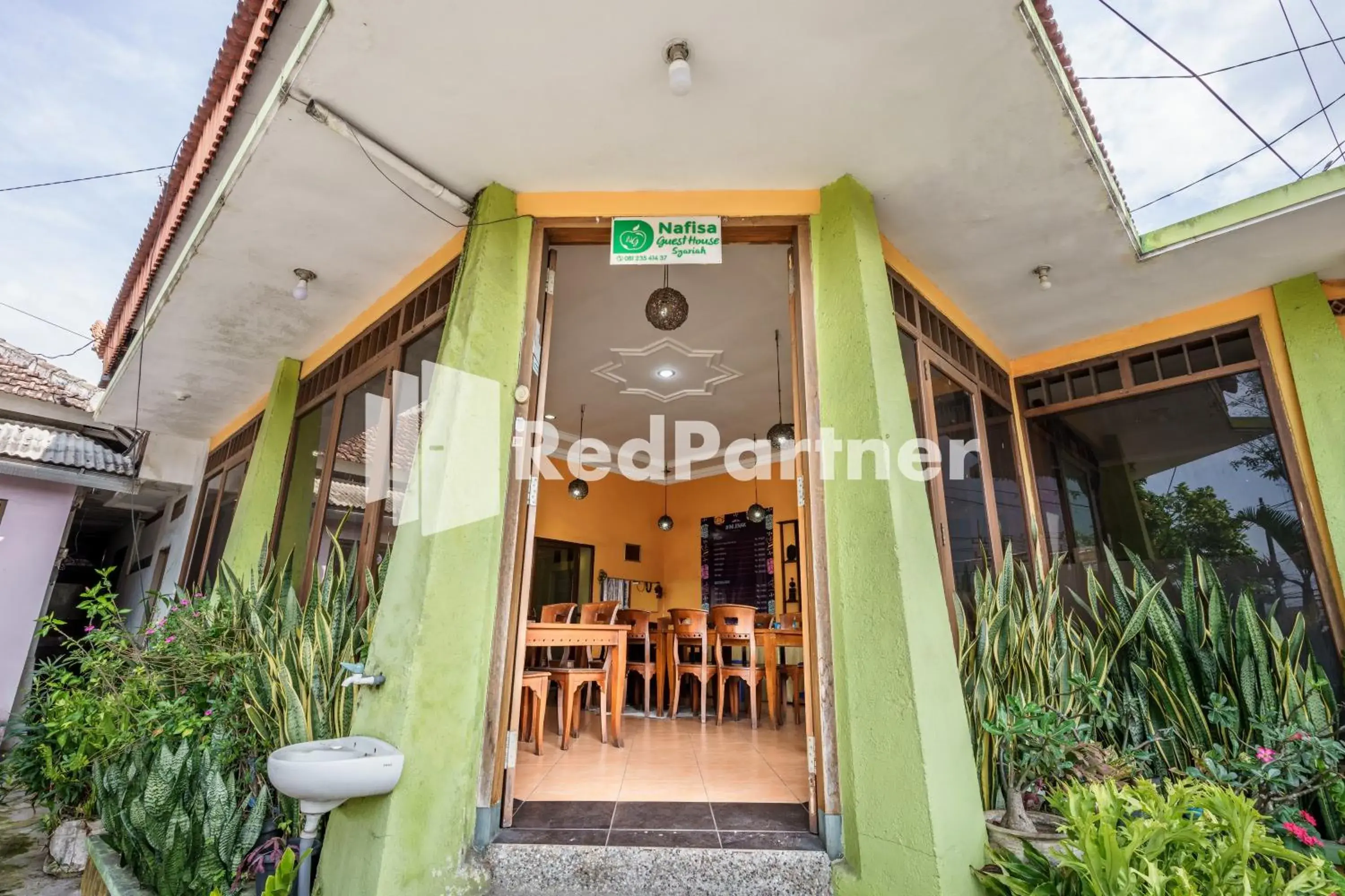 Property building in Nafisa Homestay Syariah Near Jatim Park 3 Batu Mitra RedDoorz Property building in Nafisa Homestay Syariah Near Jatim Park 3 Batu Mitra RedDoorz