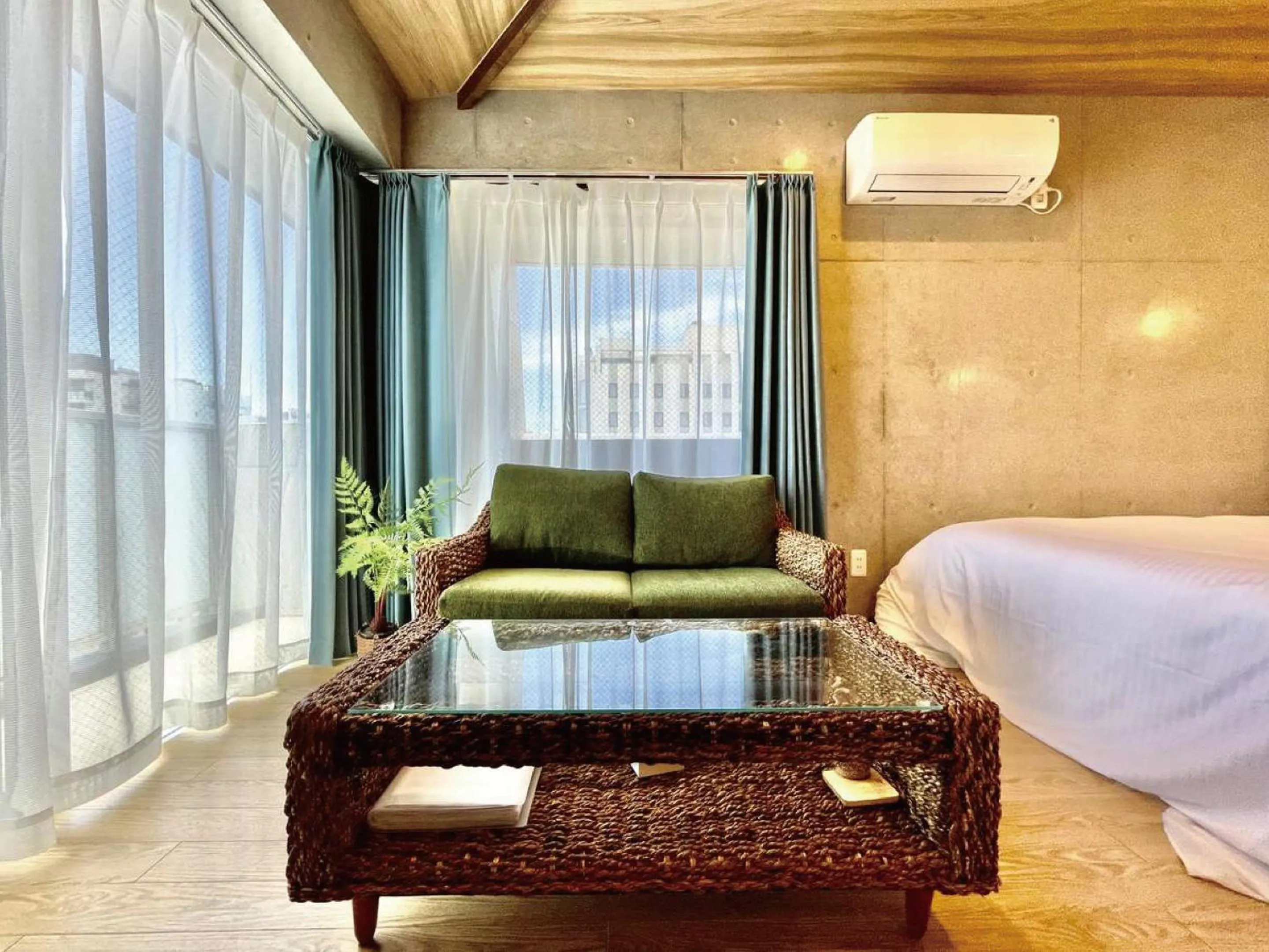 Living room, Bed in Infinity Hotel NahaKumoji -SEVEN Hotels and Resorts-