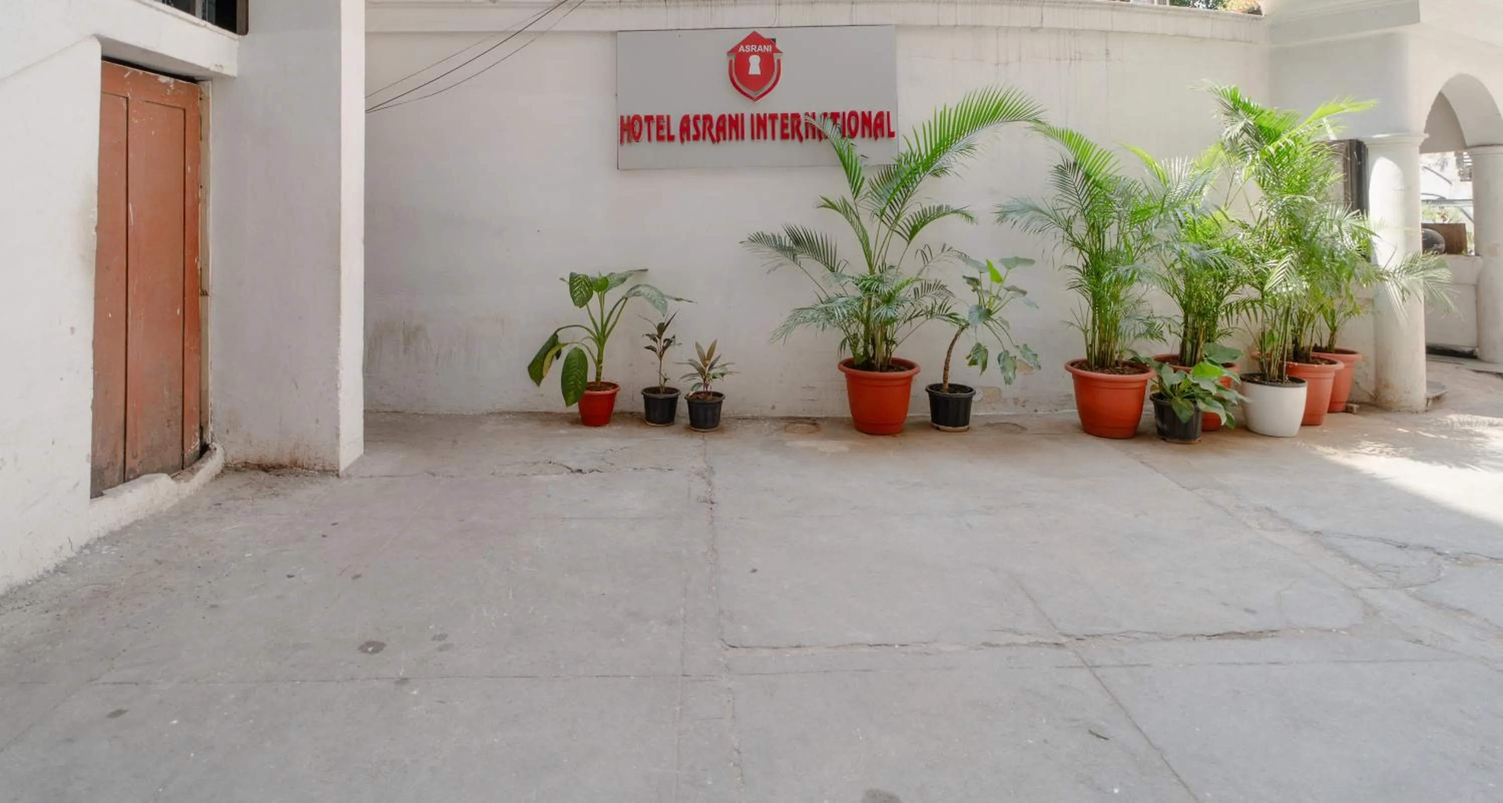 Property logo or sign in Hotel Asrani International