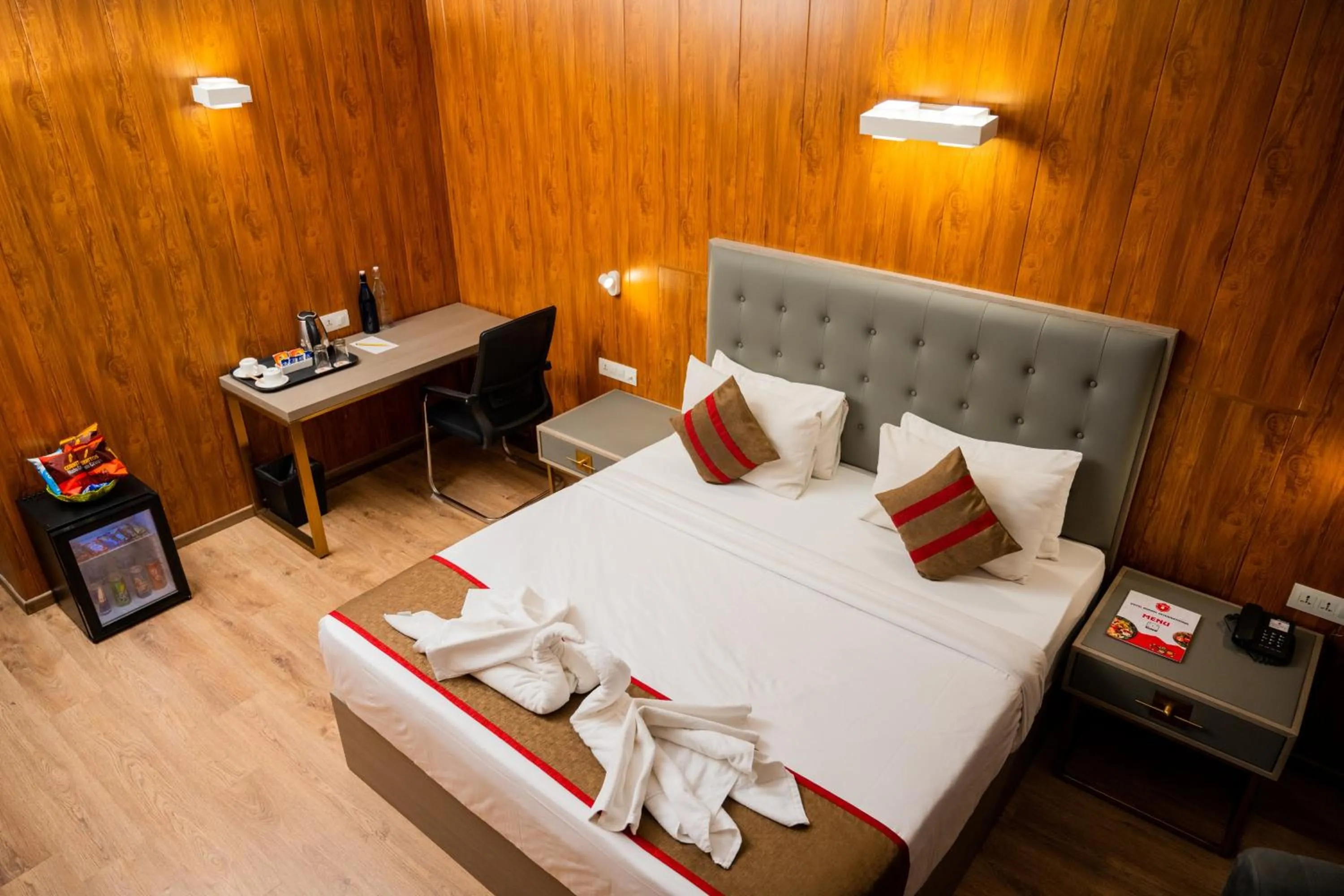 Bed in Hotel Asrani International