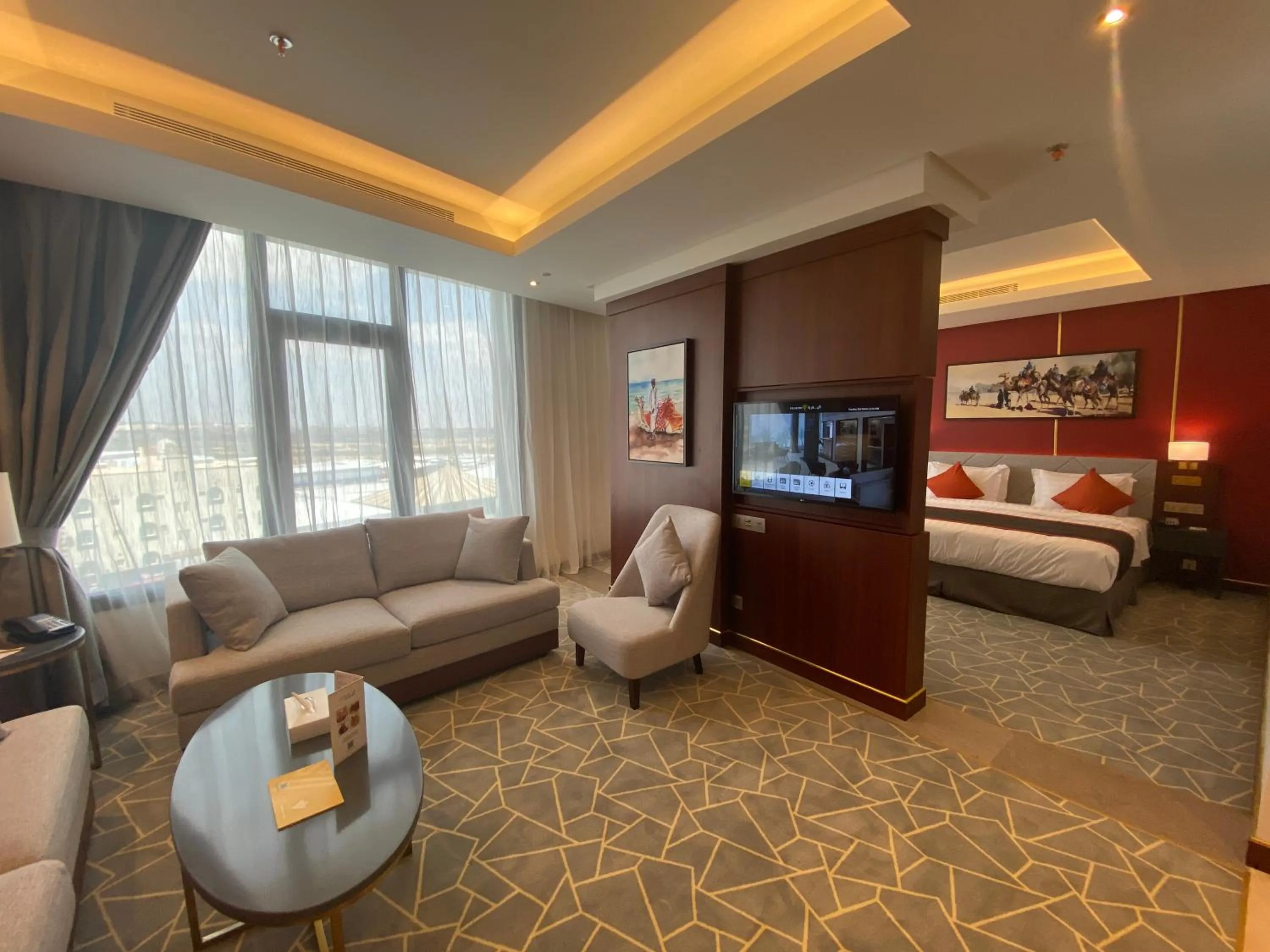 Seating area, Bed in Velar Inn Hotel