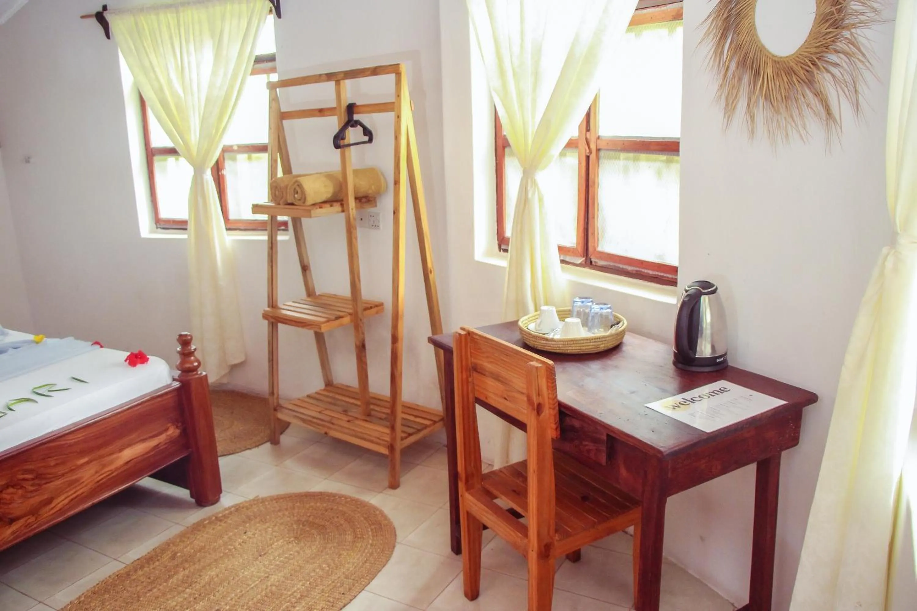 Seating area, Bed in TIKI Beach Club & Resort