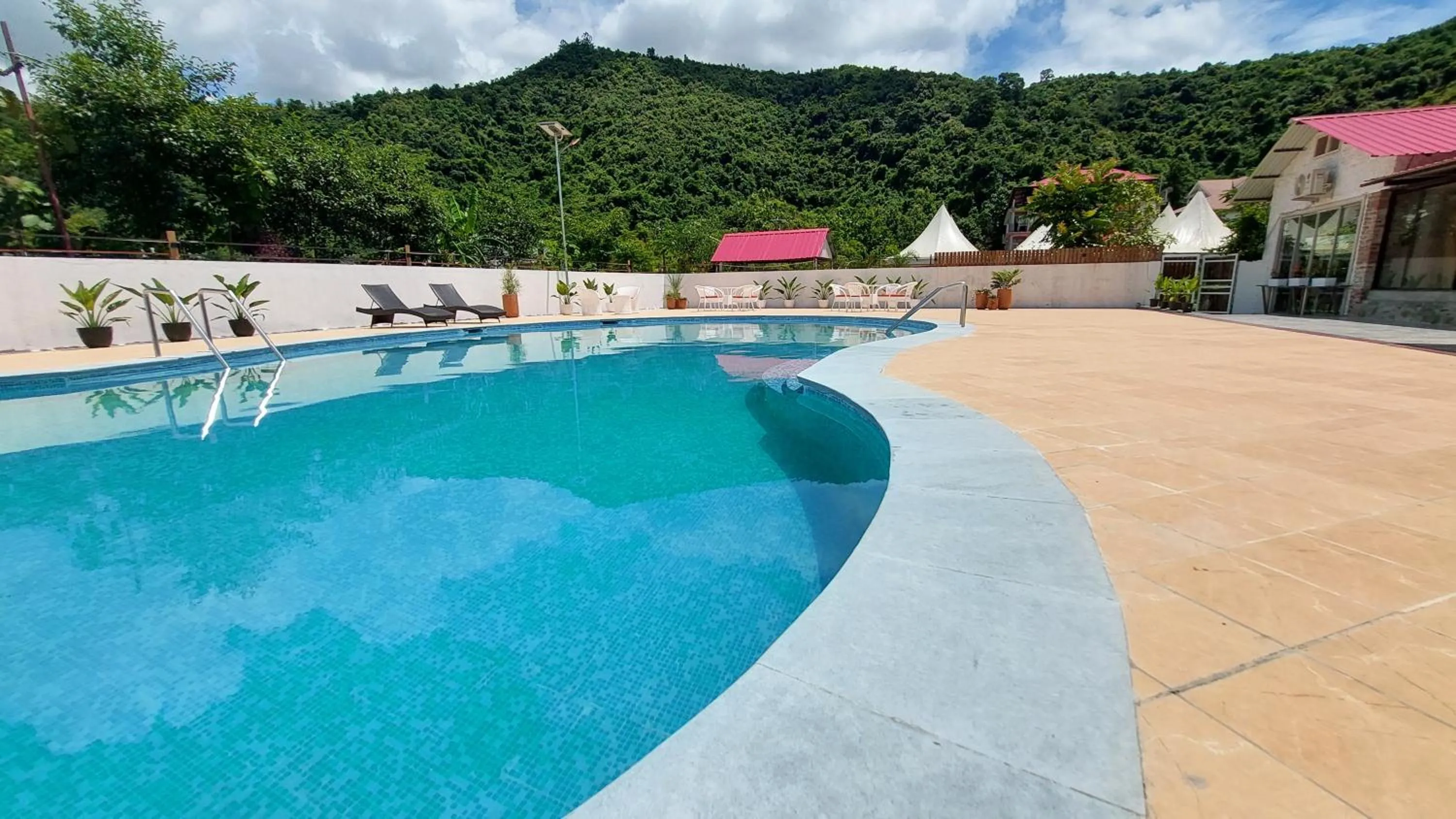Swimming pool in Shalom Farmhouse by the hillside