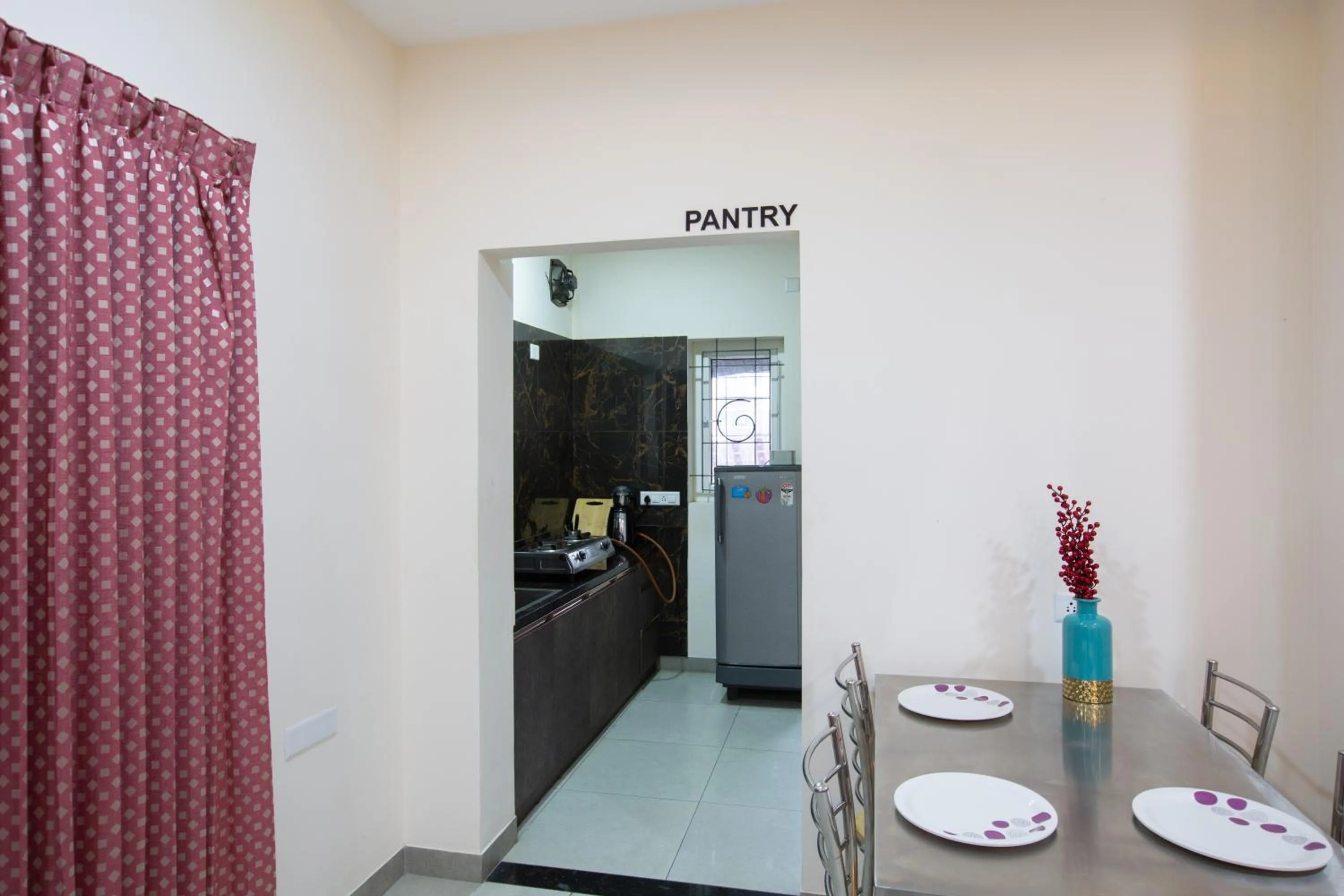 Kitchen or kitchenette in Sarvam Serviced Apartment