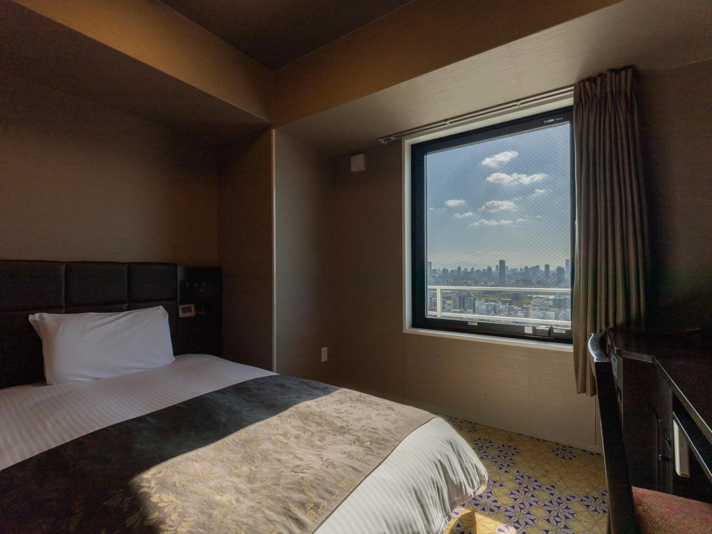 Photo of the whole room, Bed in APA Hotel Shin Osaka Ekimae Tower