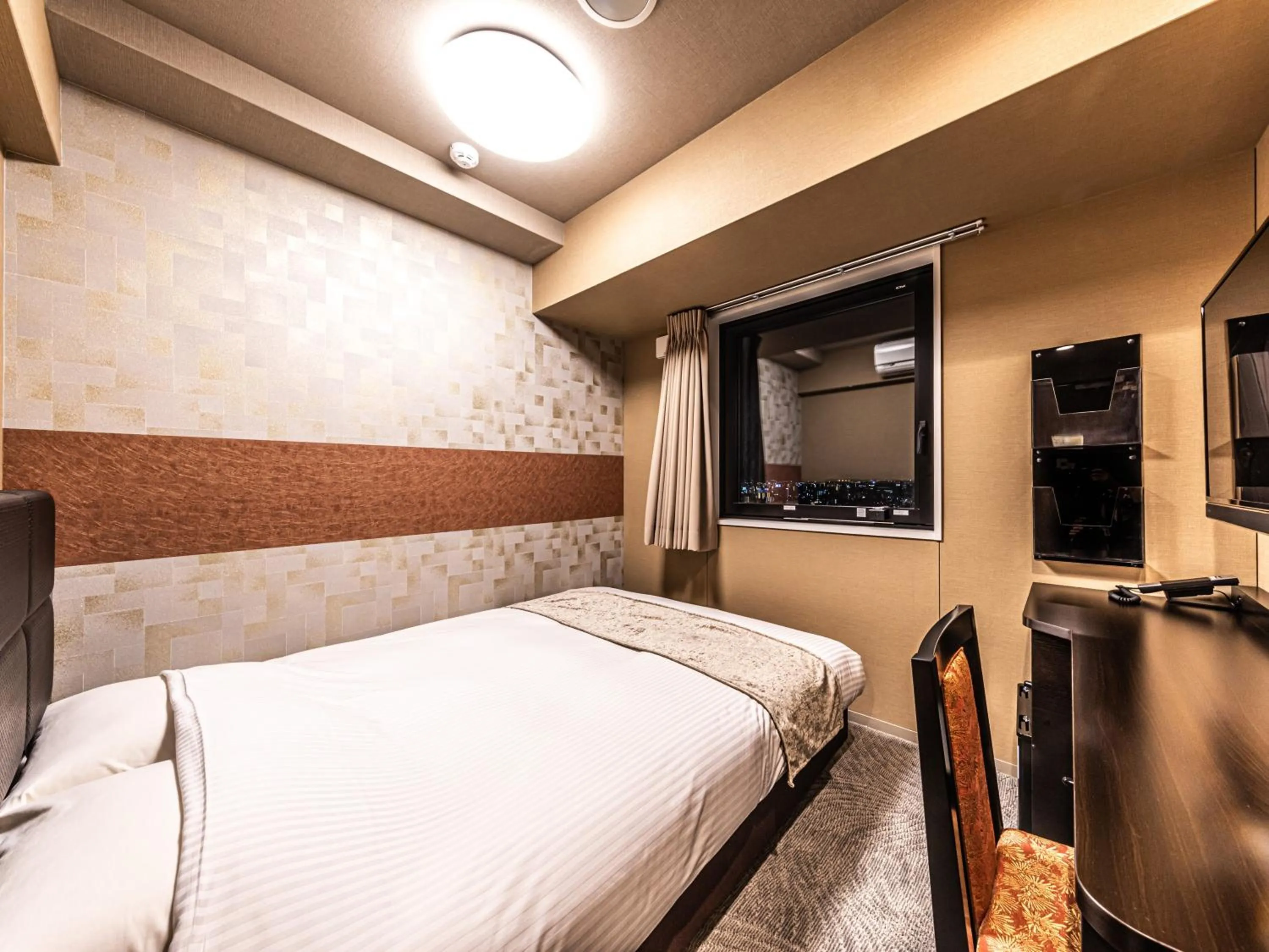 Photo of the whole room, Bed in APA Hotel Shin Osaka Ekimae Tower