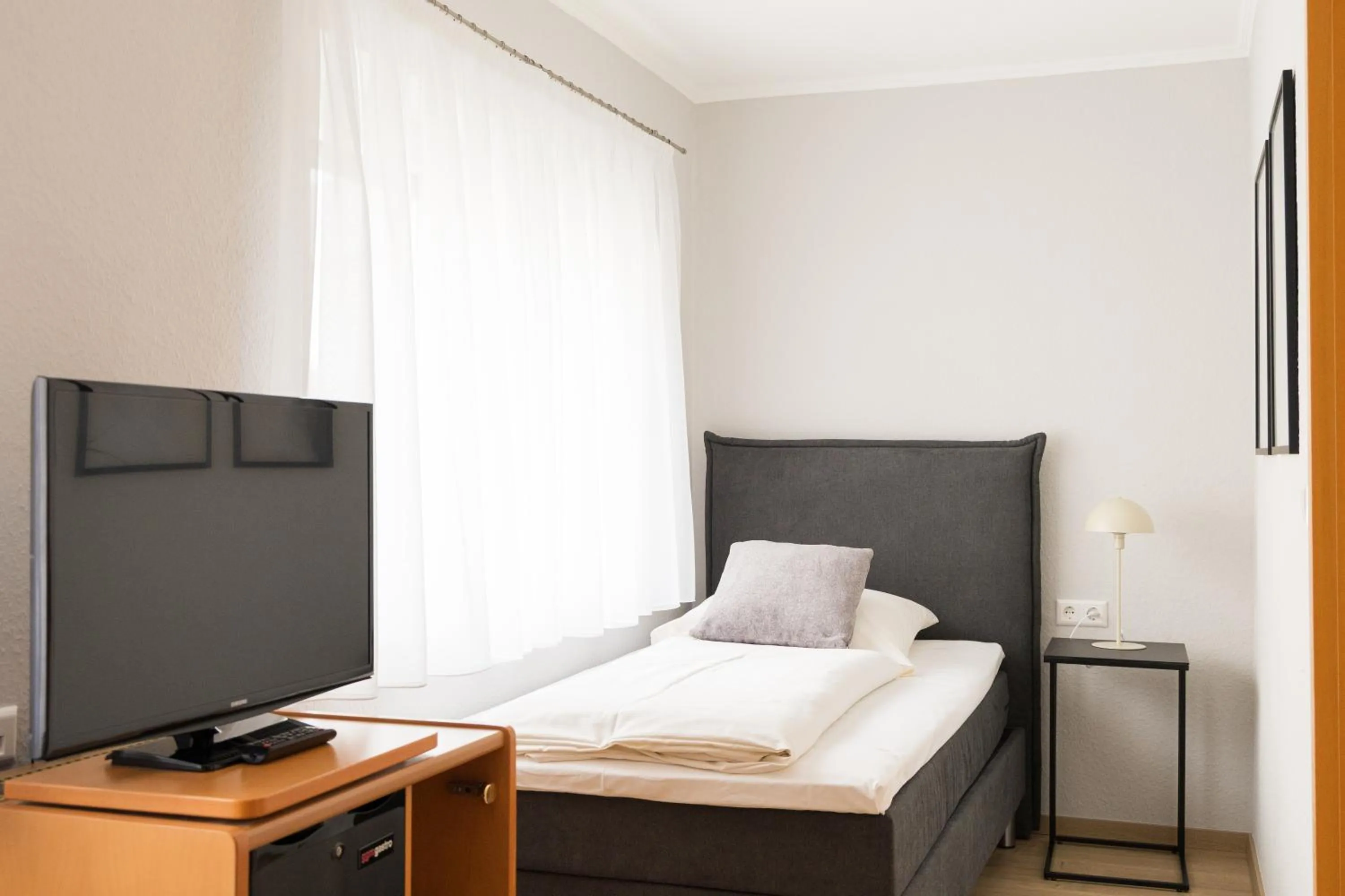TV and multimedia, Bed in Hotel Garni Promenade