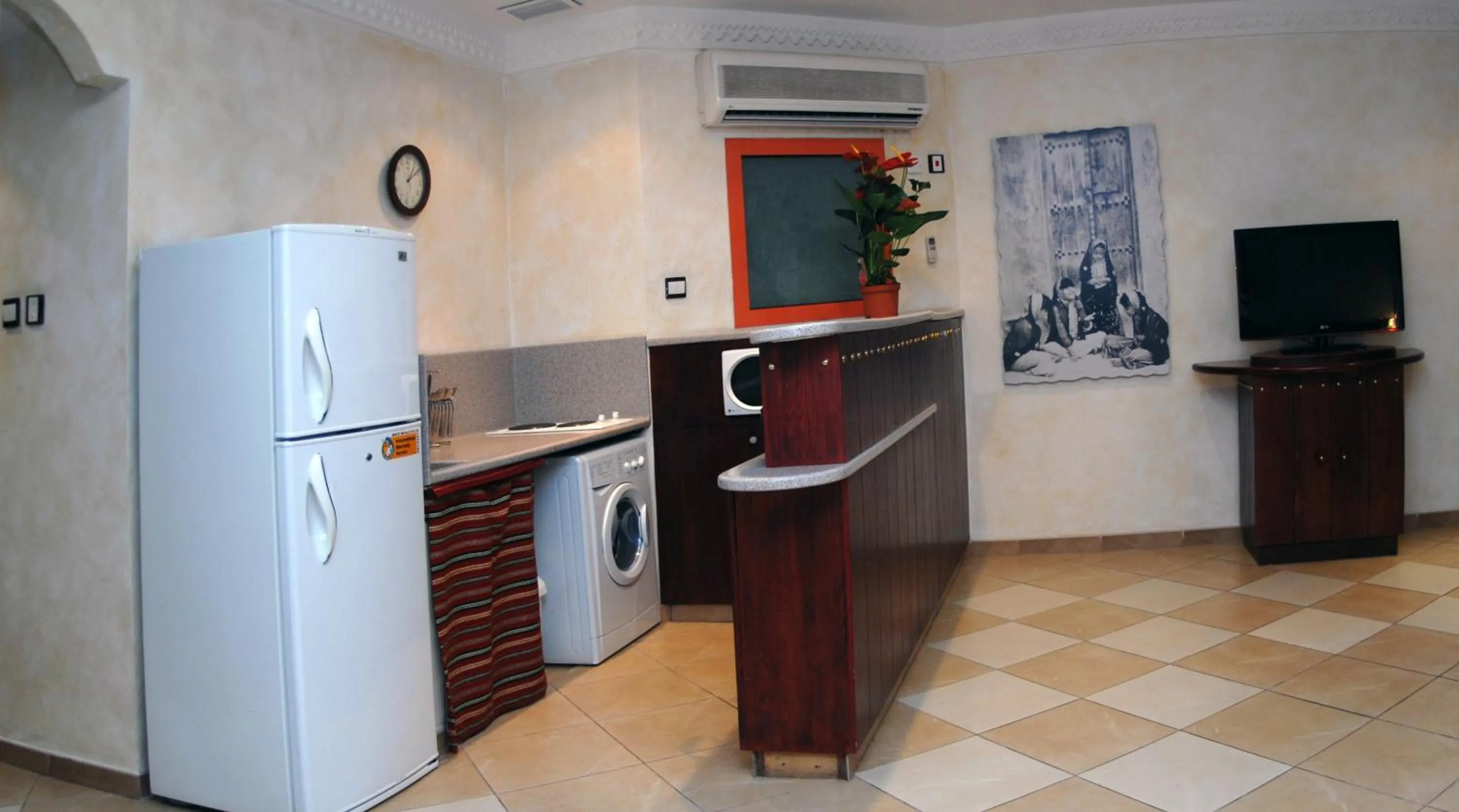 Kitchen or kitchenette in Al Liwan Suites