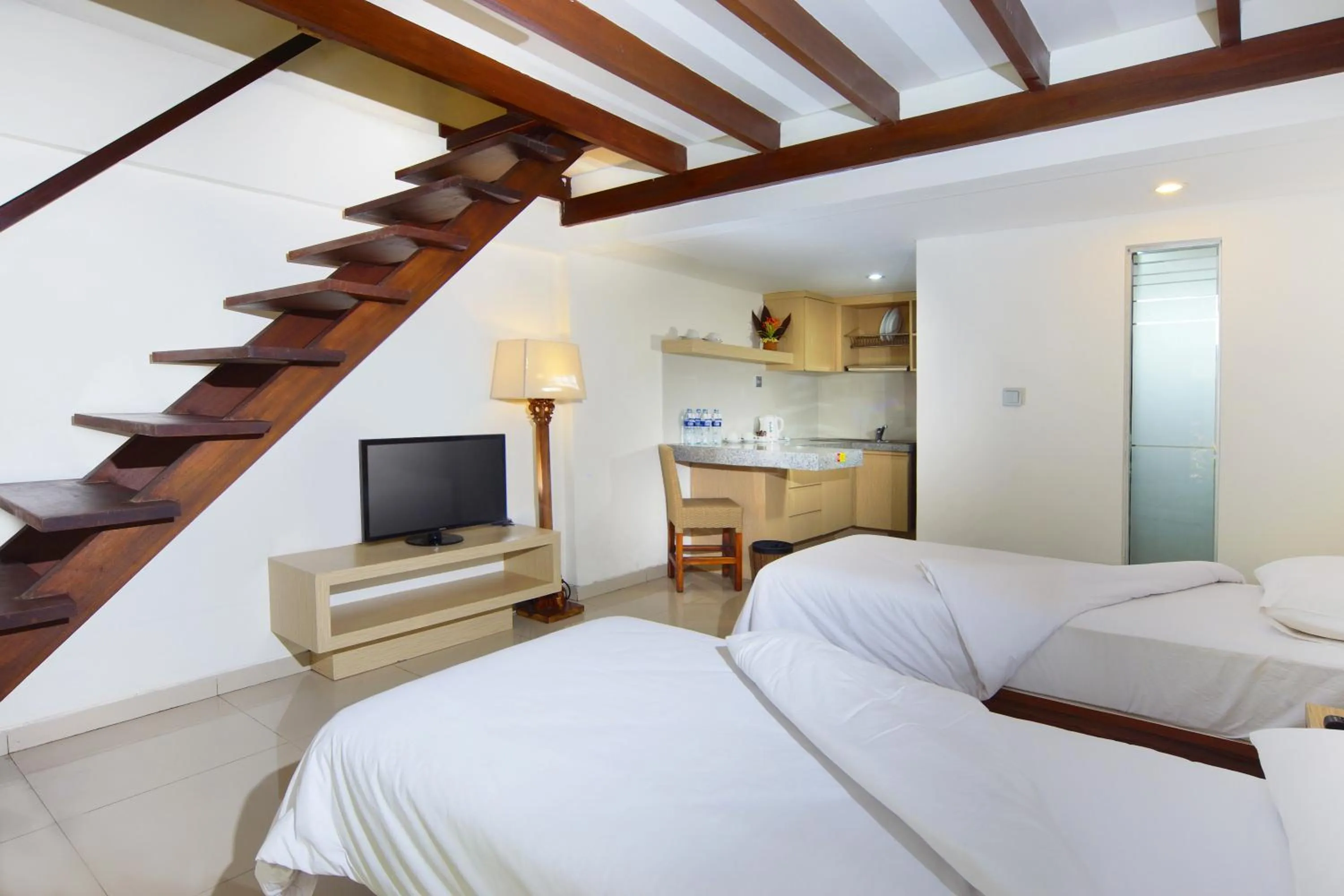 Bed in The Legian Sunset Residence