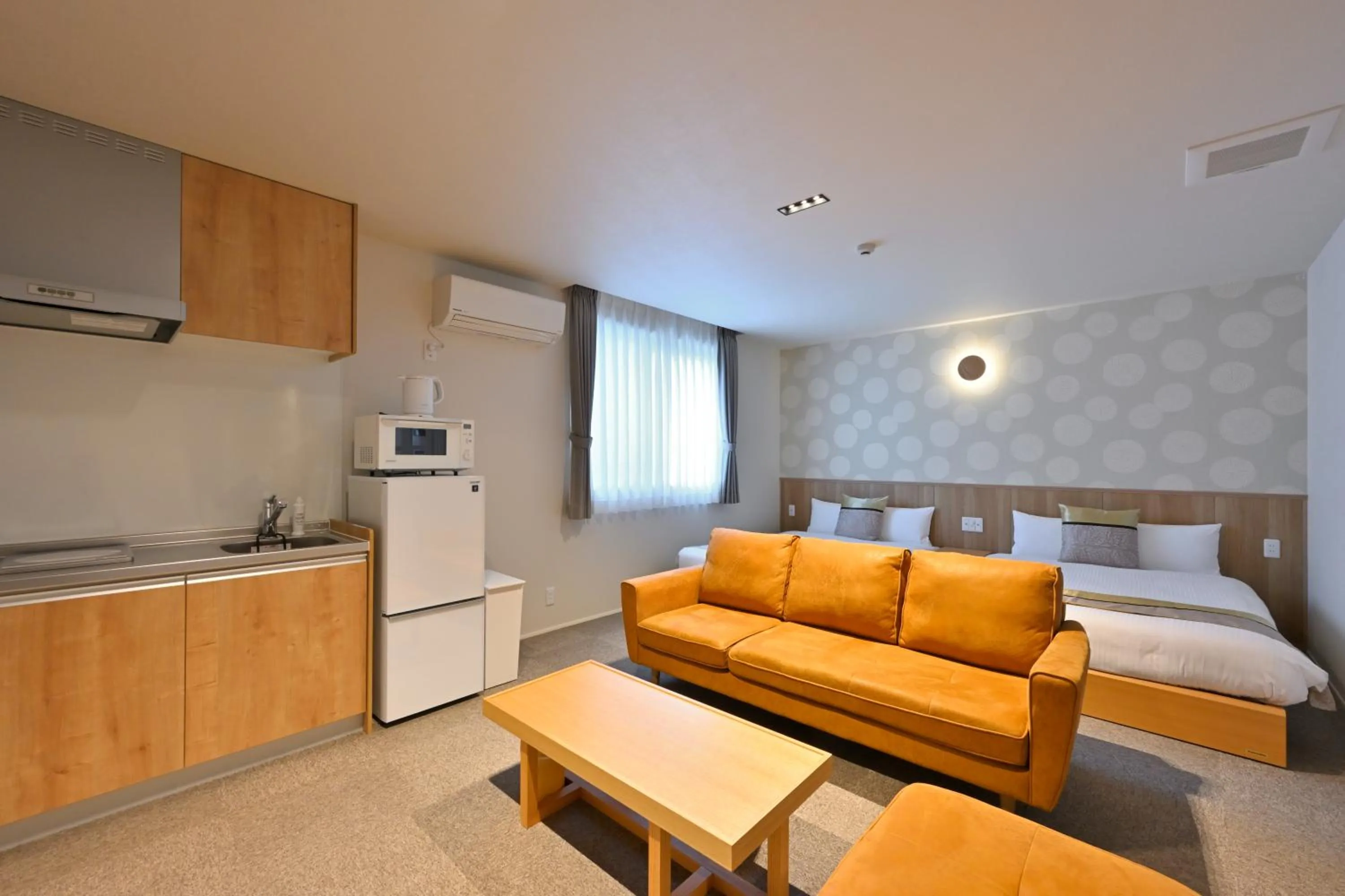 Photo of the whole room, Bed in GRAND BASE Hiroshima Peace Memorial Park