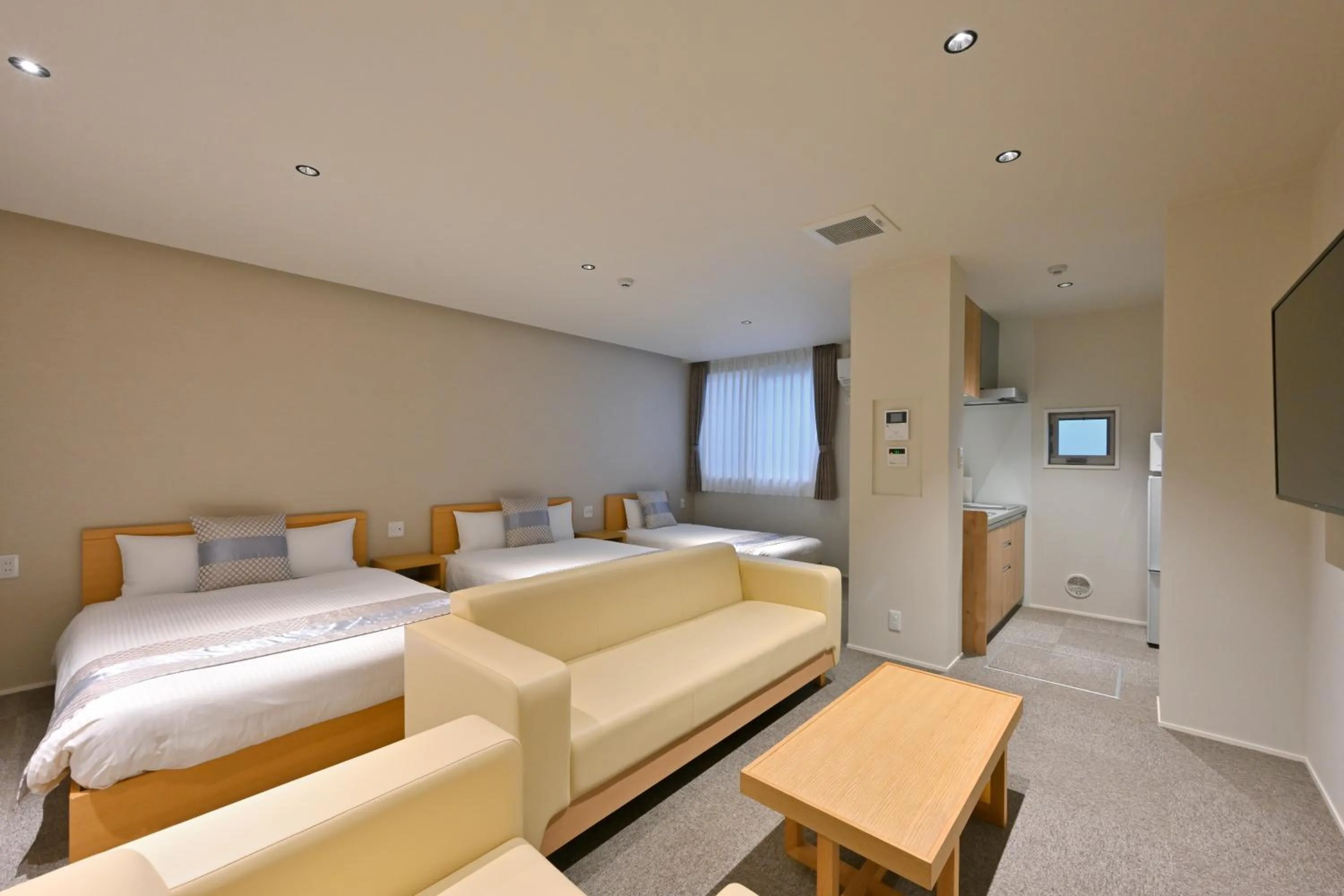 Photo of the whole room, Bed in GRAND BASE Hiroshima Peace Memorial Park