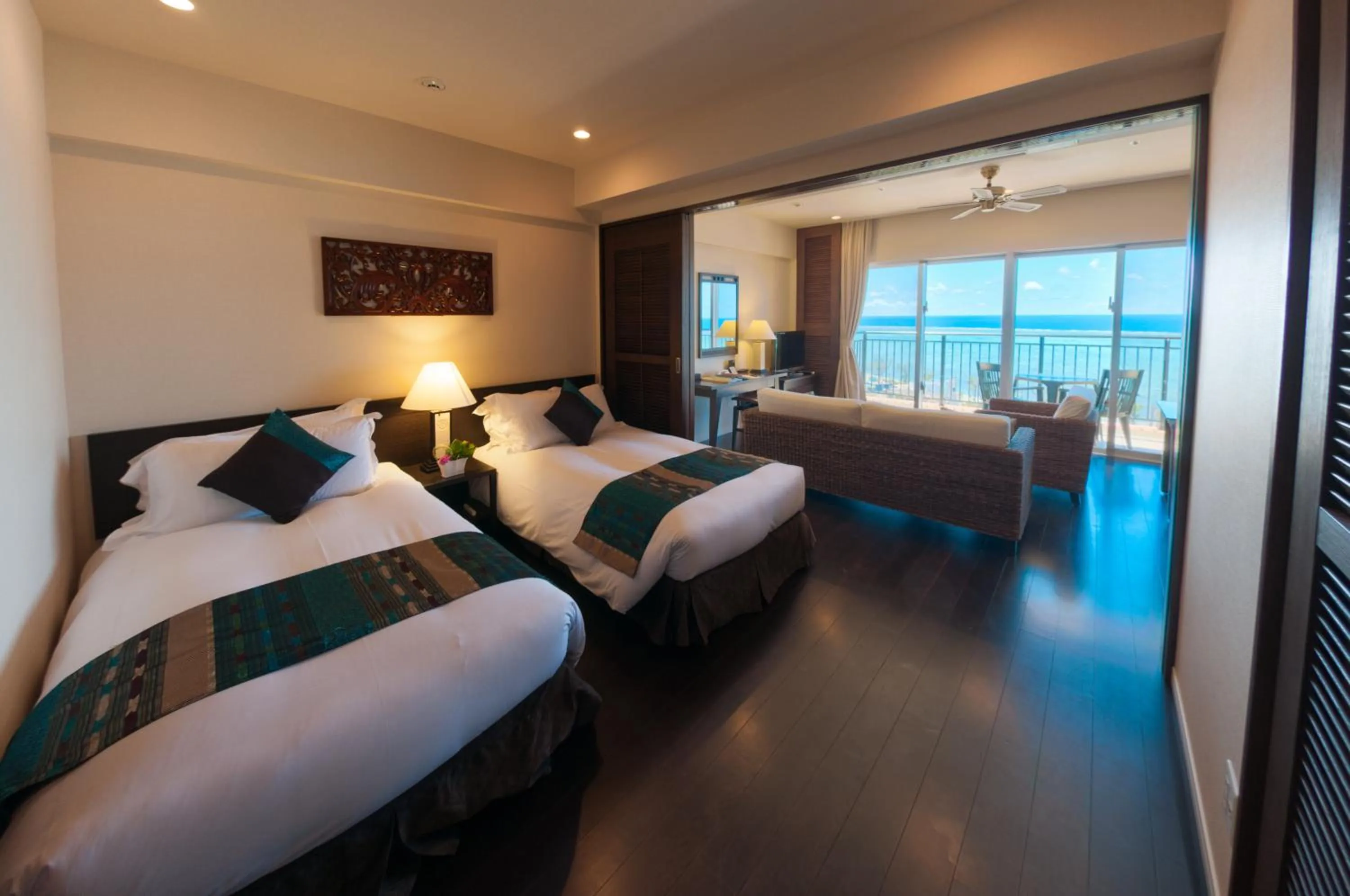 Bed in Kafuu Resort Fuchaku Condo Hotel