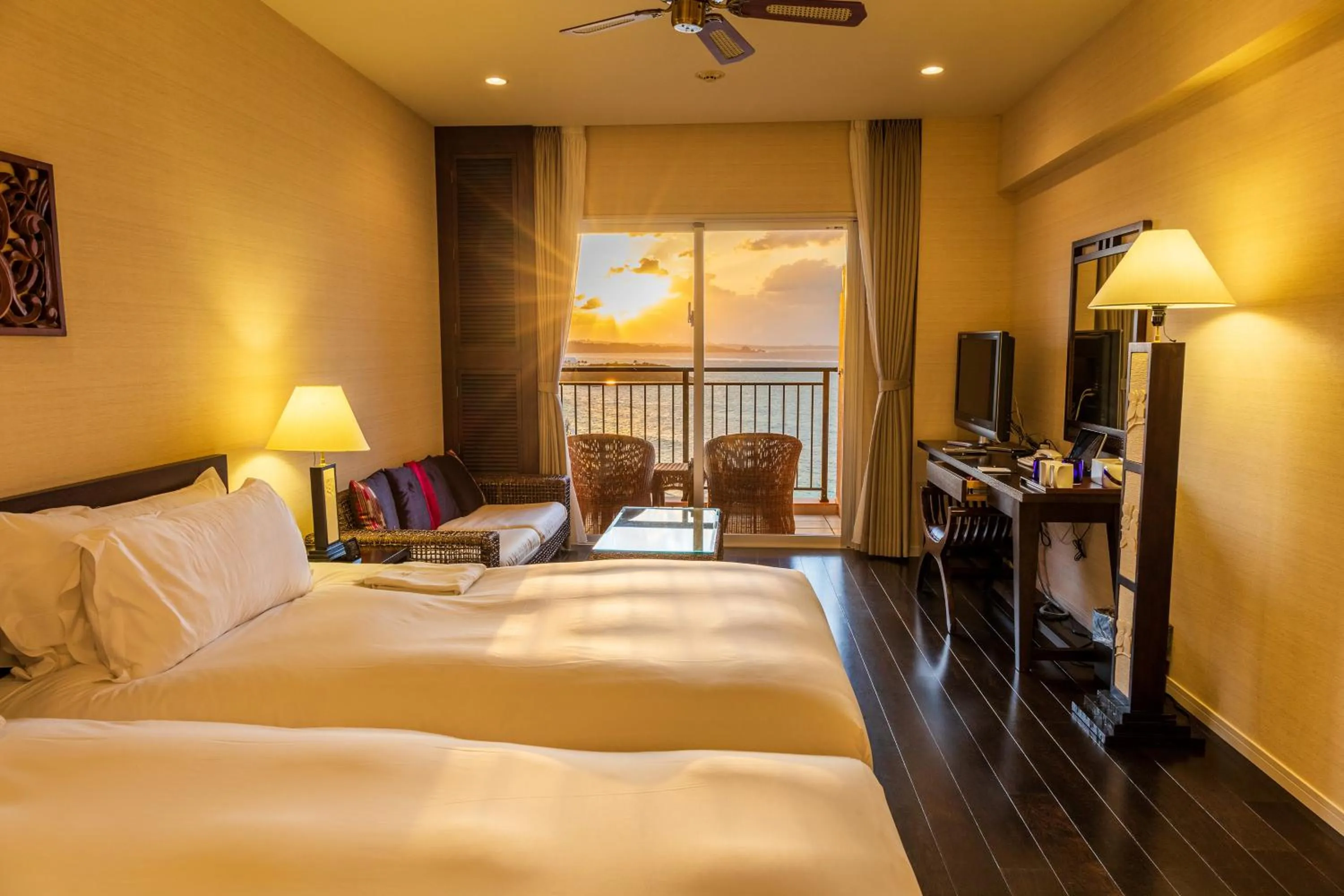 Bed in Kafuu Resort Fuchaku Condo Hotel