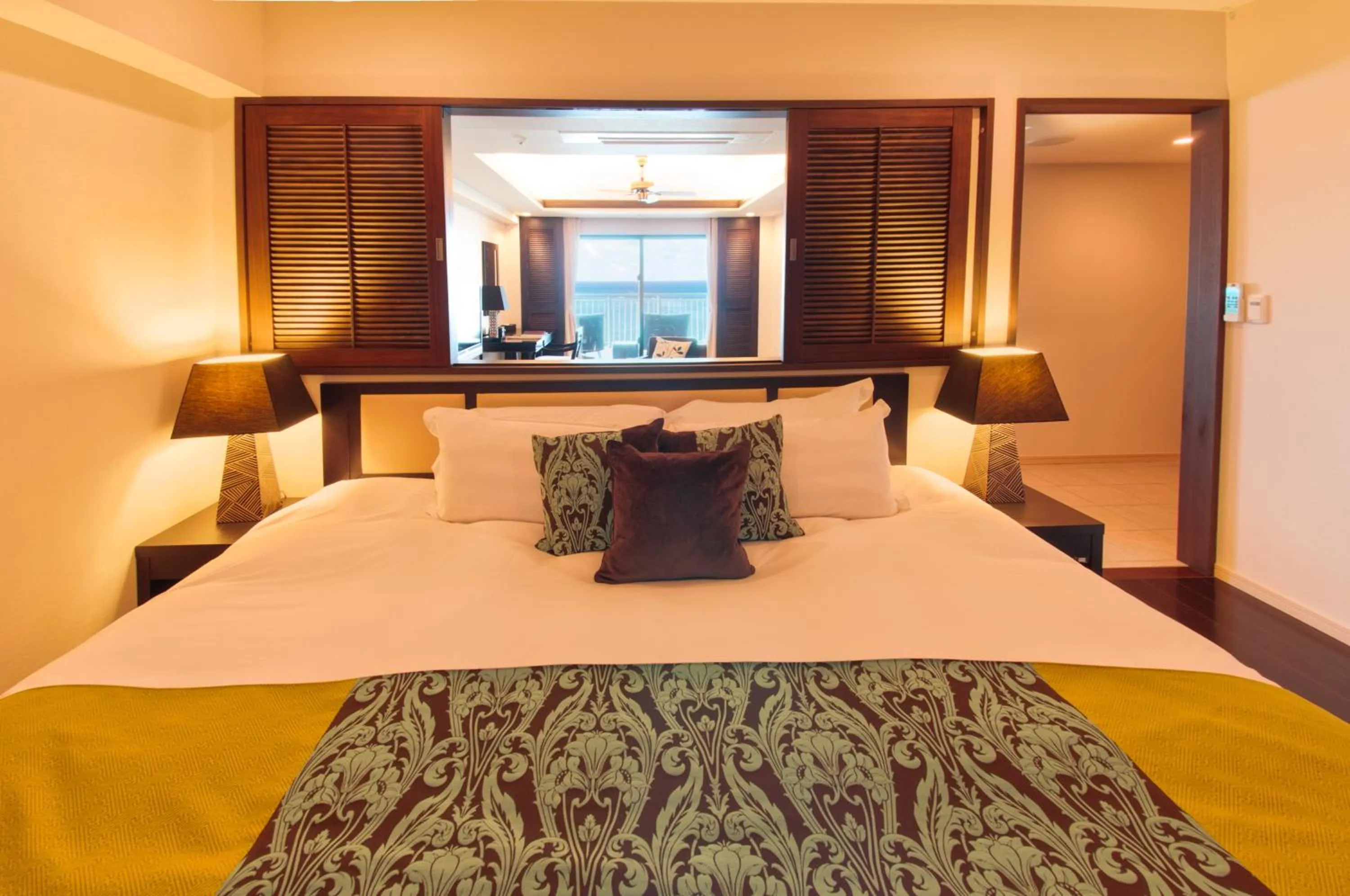 Bed in Kafuu Resort Fuchaku Condo Hotel