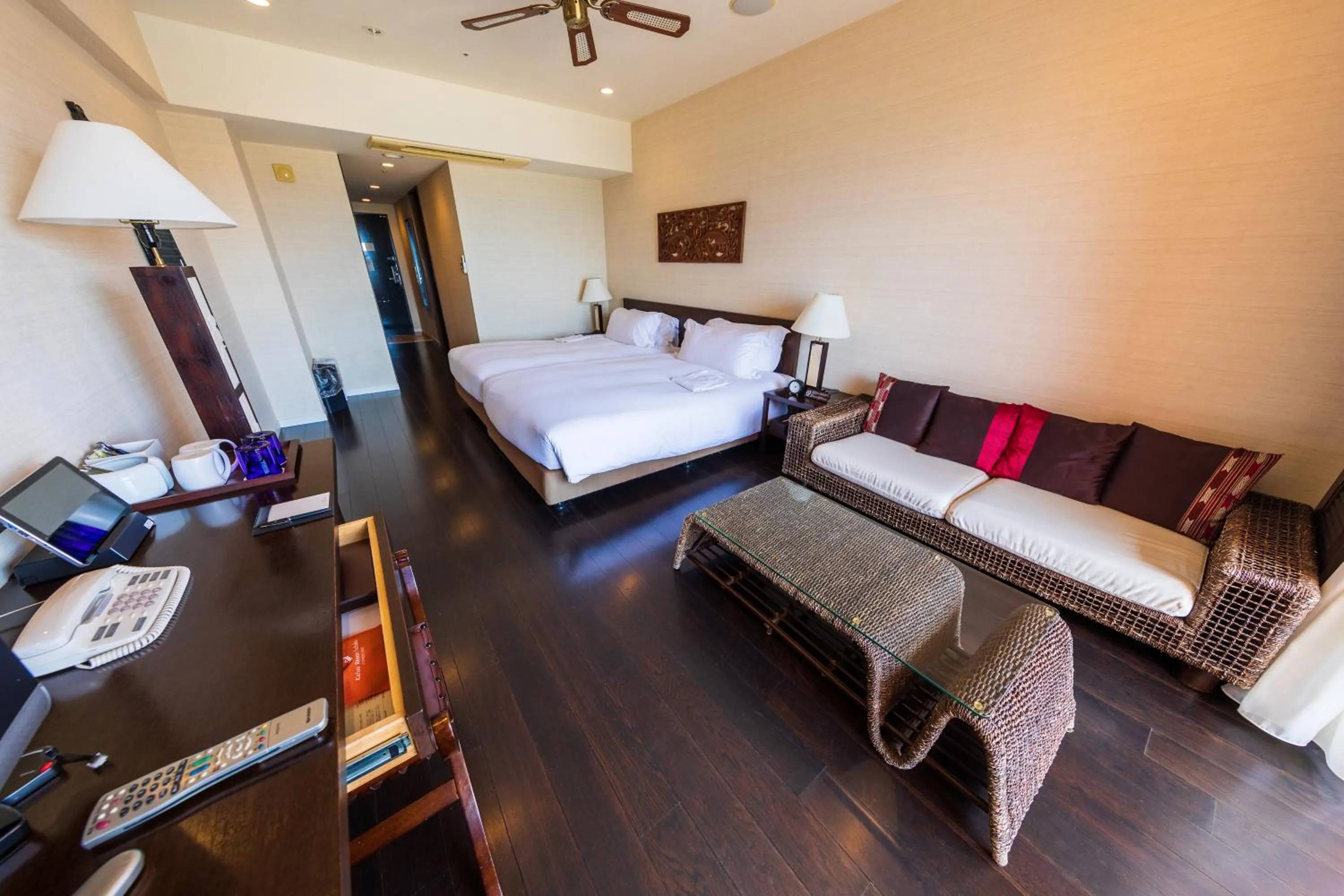 Bed in Kafuu Resort Fuchaku Condo Hotel