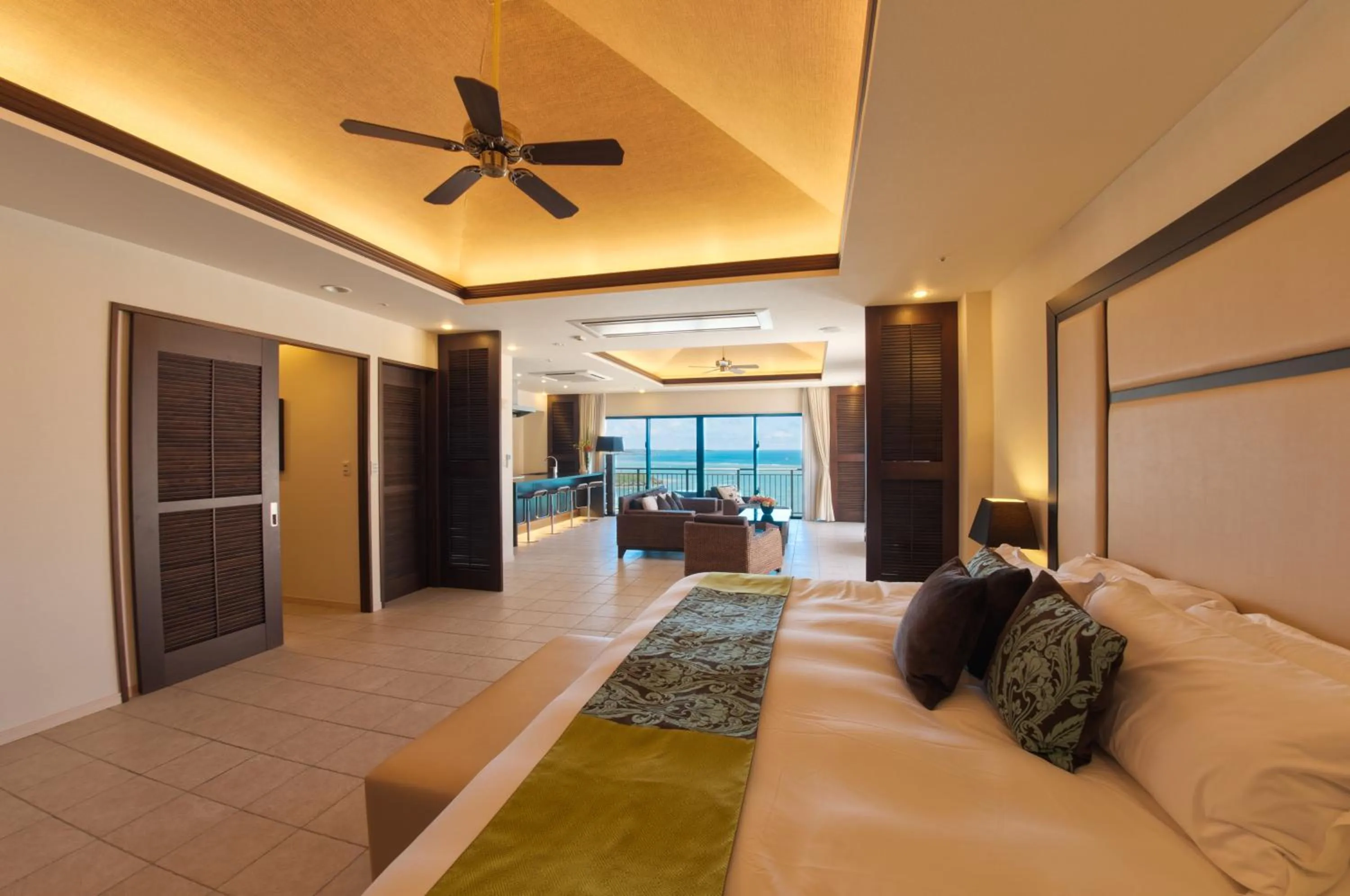 Bed in Kafuu Resort Fuchaku Condo Hotel