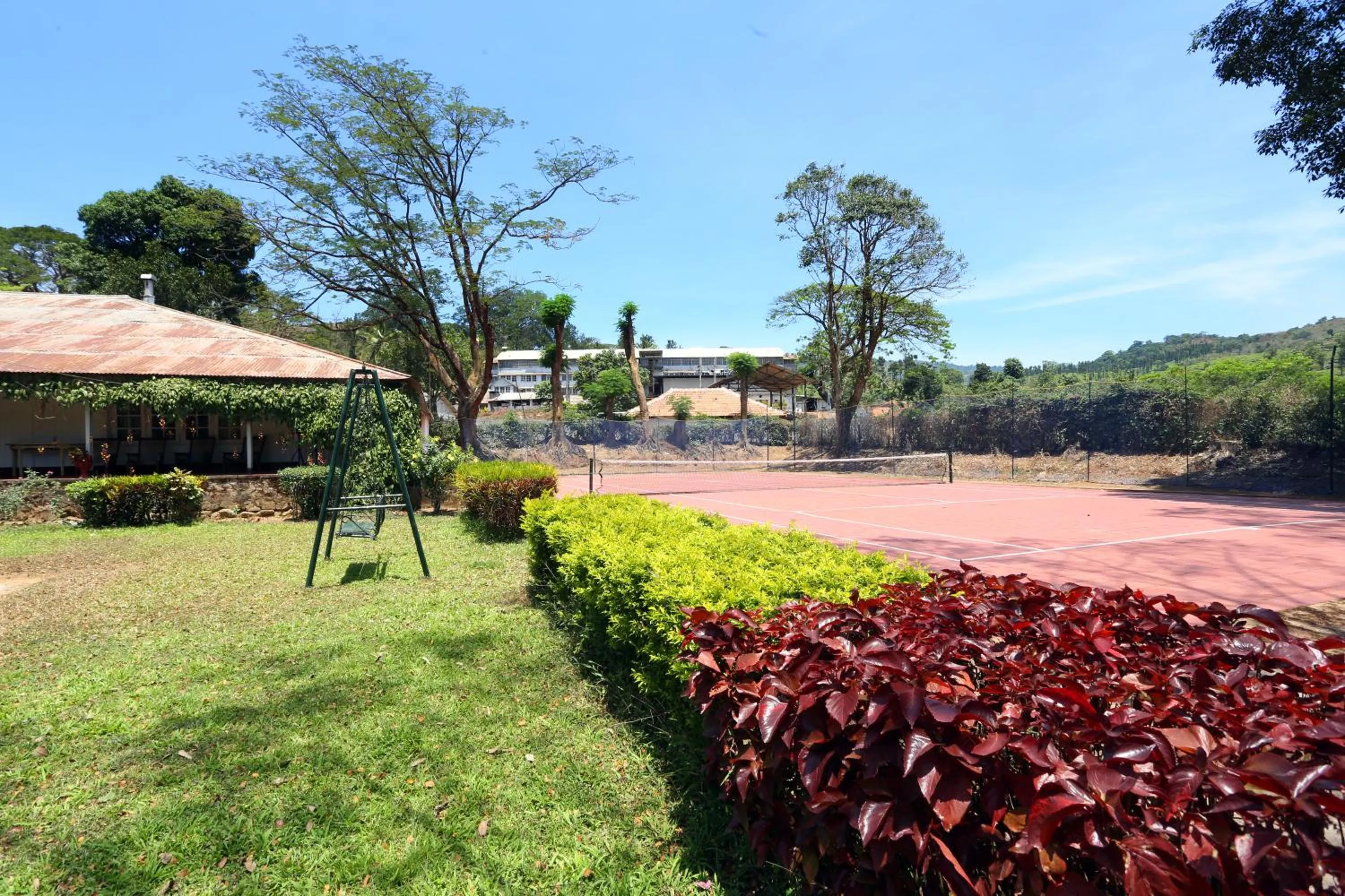 Tennis court in Parisons Plantation Experiences by Abad