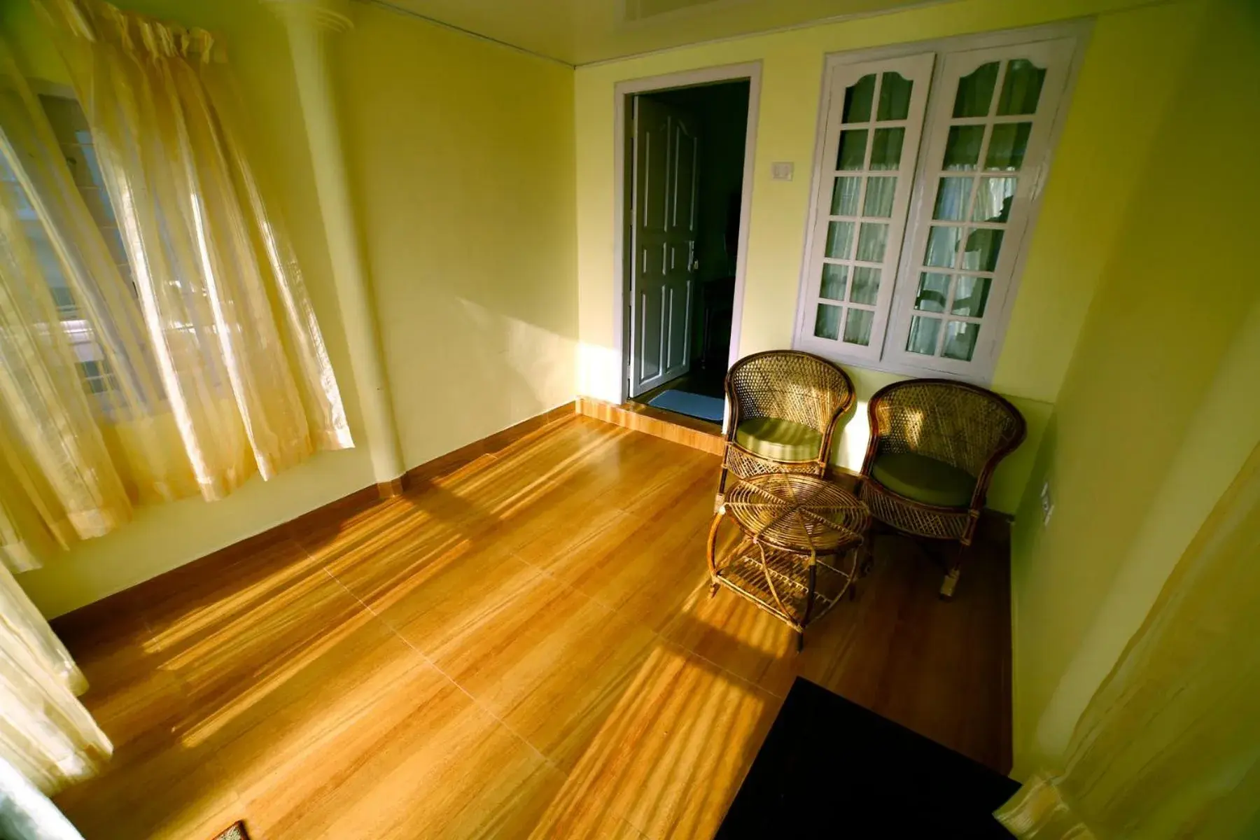 Seating area, Bed in Holiday Heaven Munnar Seating area, Bed in Holiday Heaven Munnar