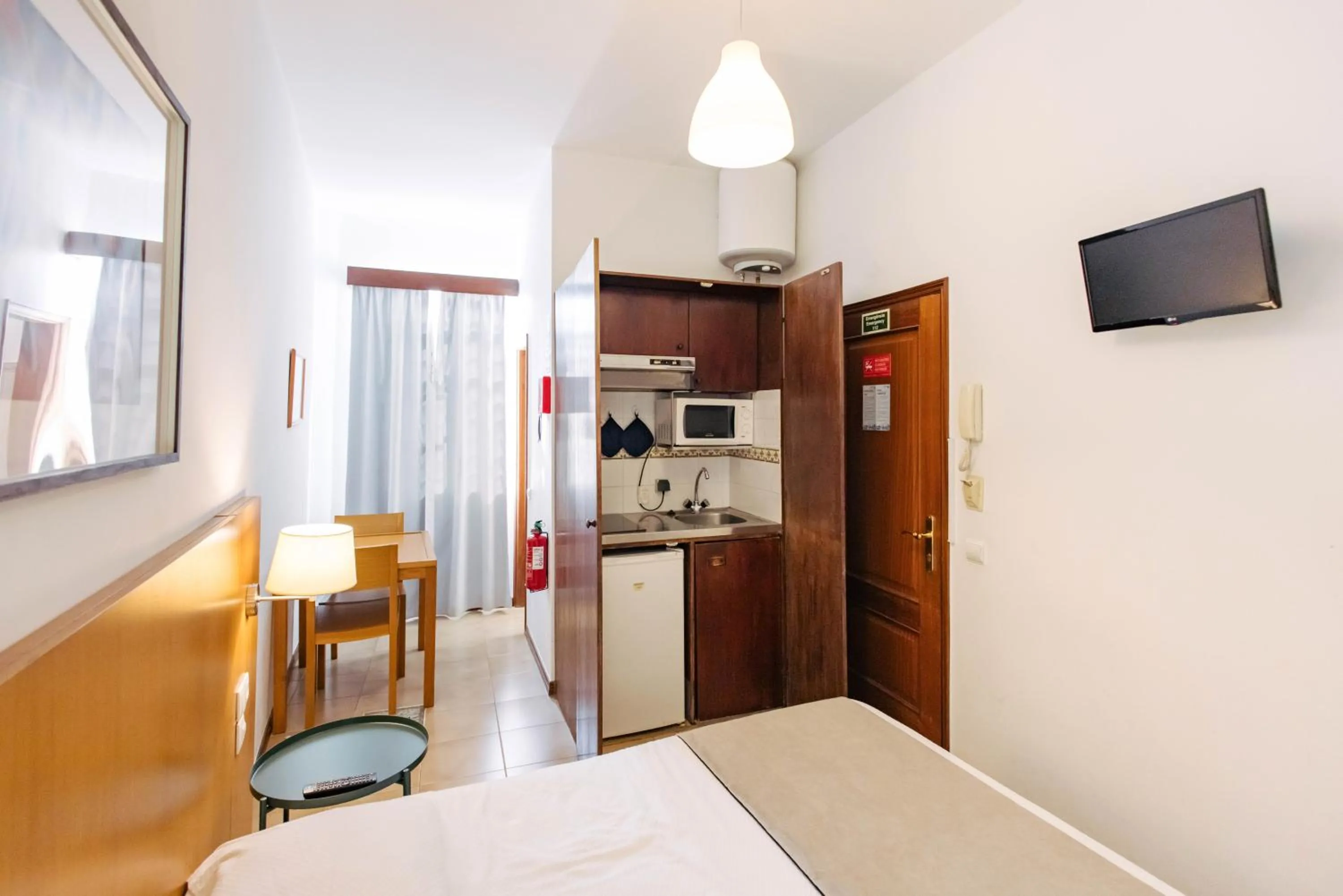 Kitchen or kitchenette, Bed in Murças74 - Studio Apartments