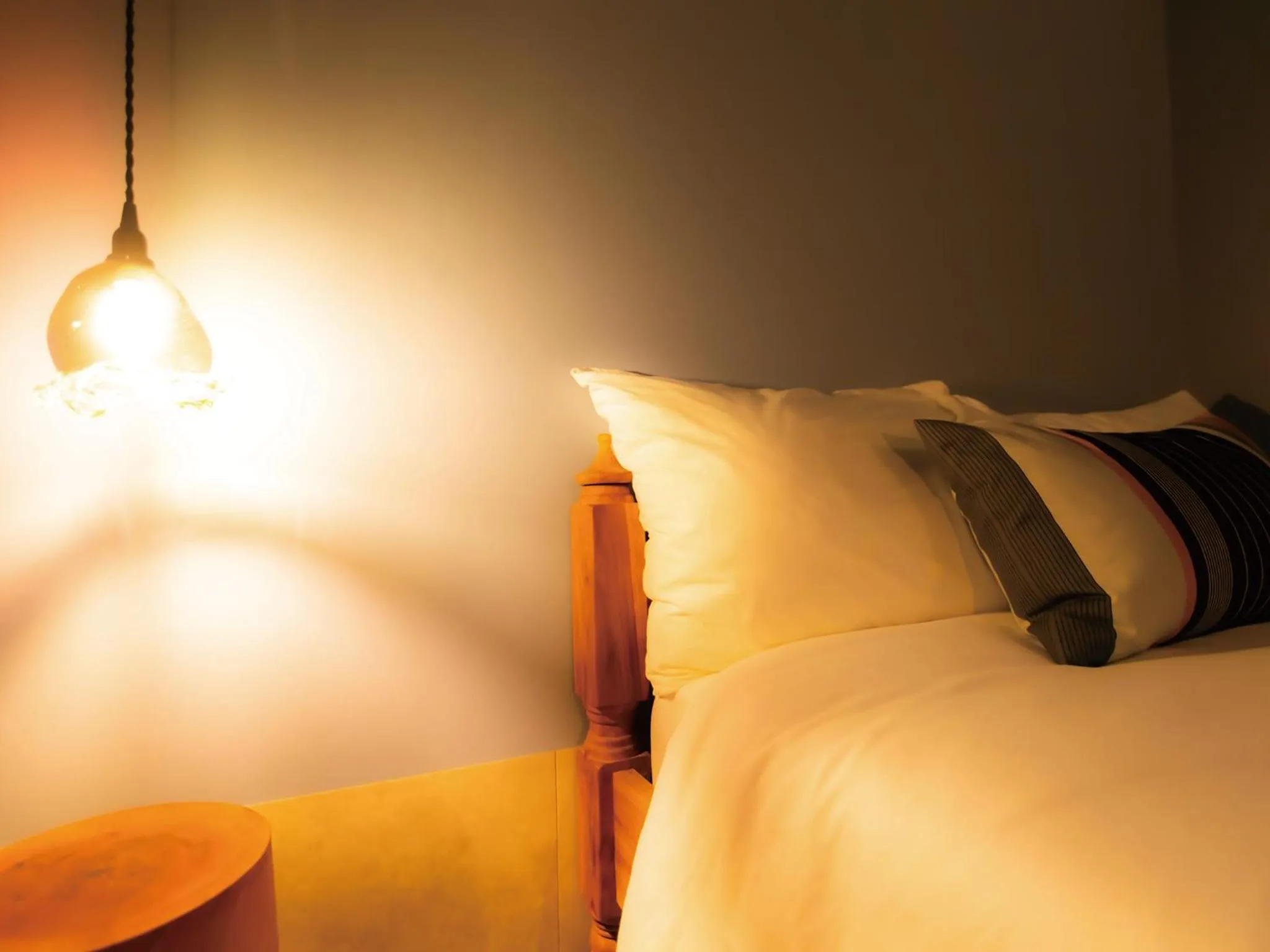 Bed in CHULAX OKINAWA YOMITAN【Designer Condominium Hotel】