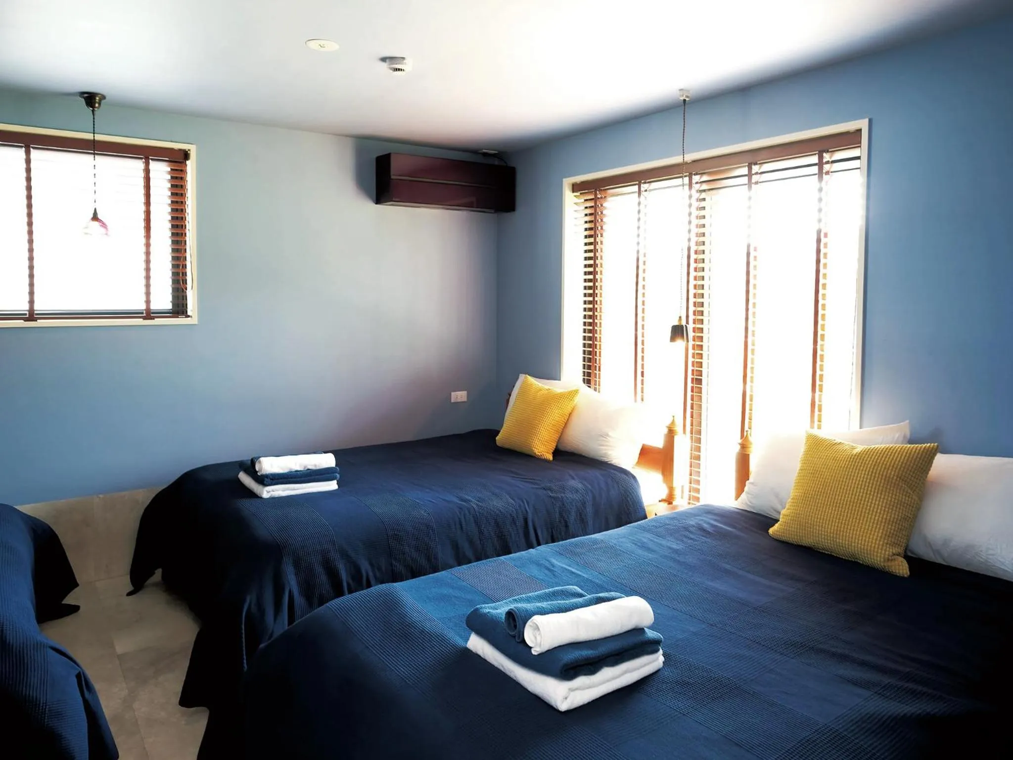 Bed in CHULAX OKINAWA YOMITAN【Designer Condominium Hotel】