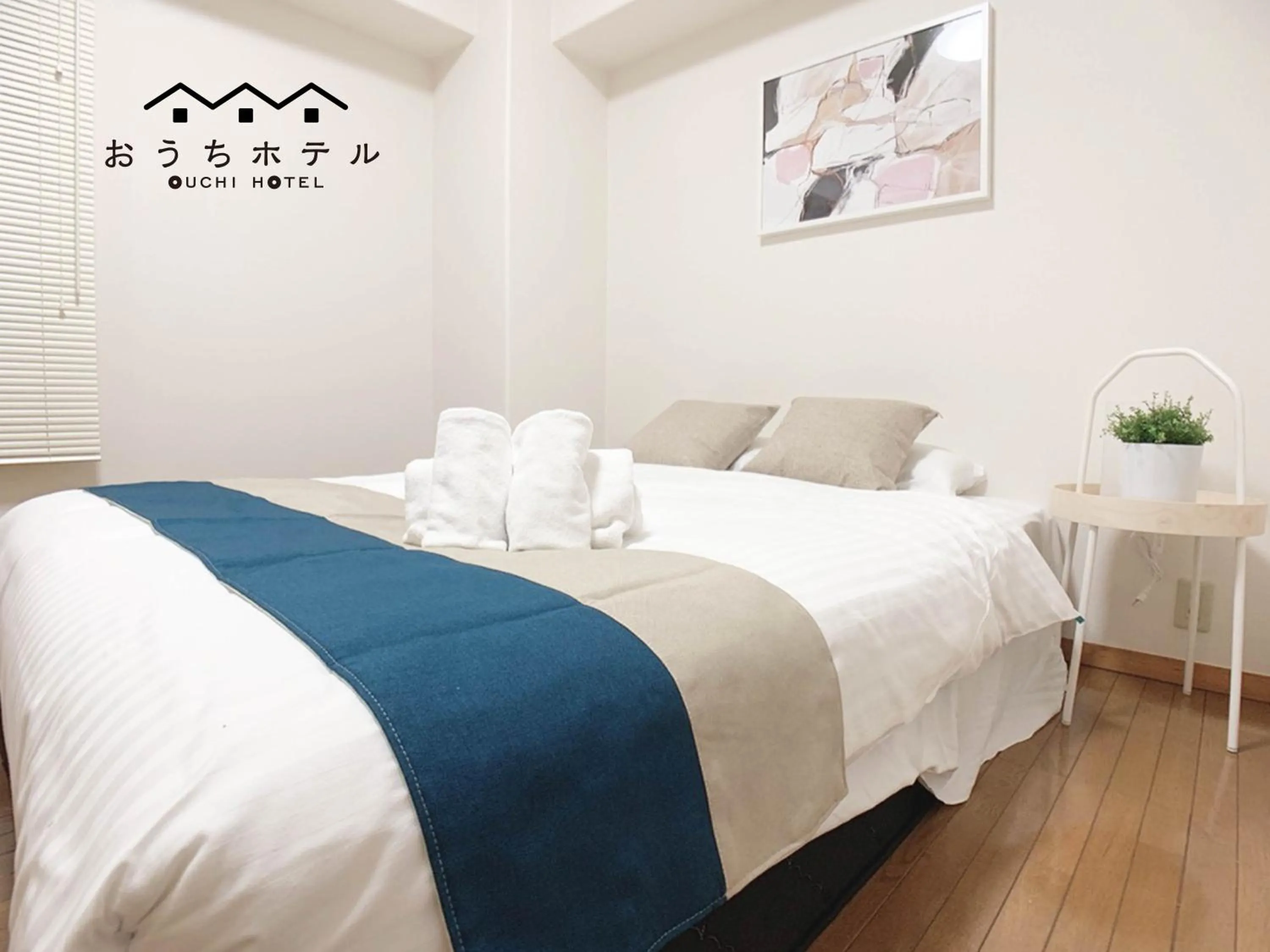 Bed in OUCHI HOTEL Hijiyama