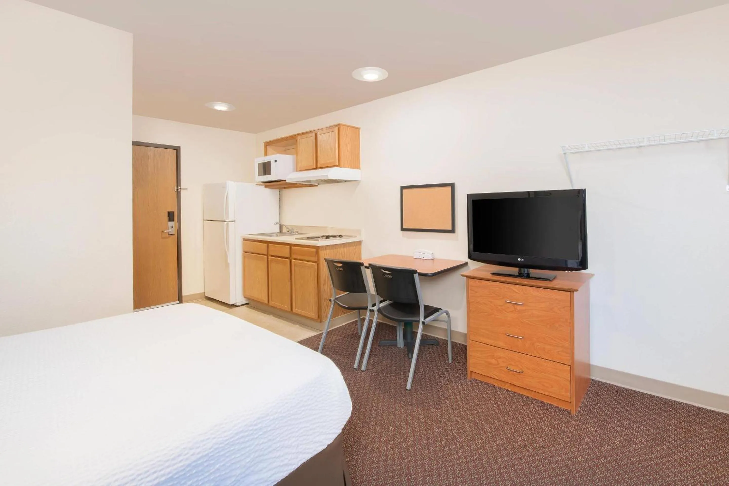 Bedroom, Bed in WoodSpring Suites Columbus near Fort Benning