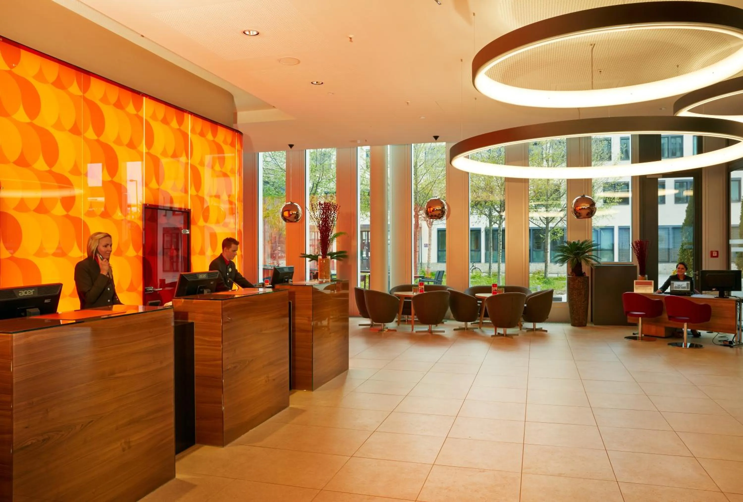 Lobby or reception in H4 Hotel München Messe