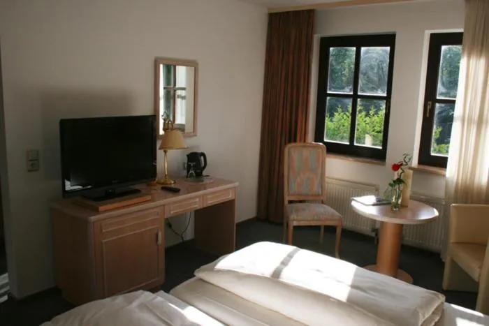 Photo of the whole room, Bed in Landhotel Burkartsmühle