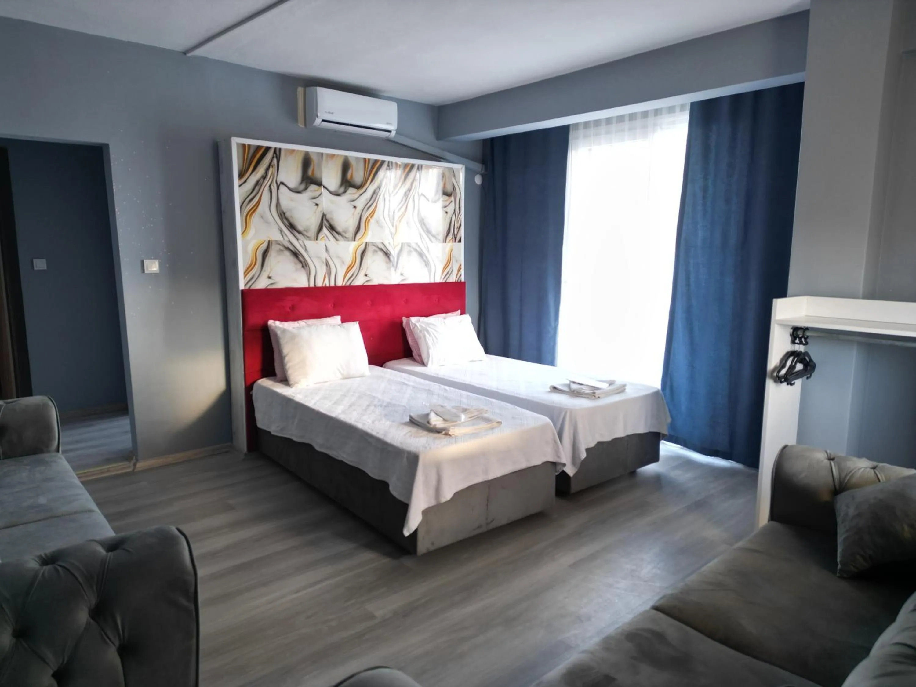 Living room, Bed in Akman City Hotel