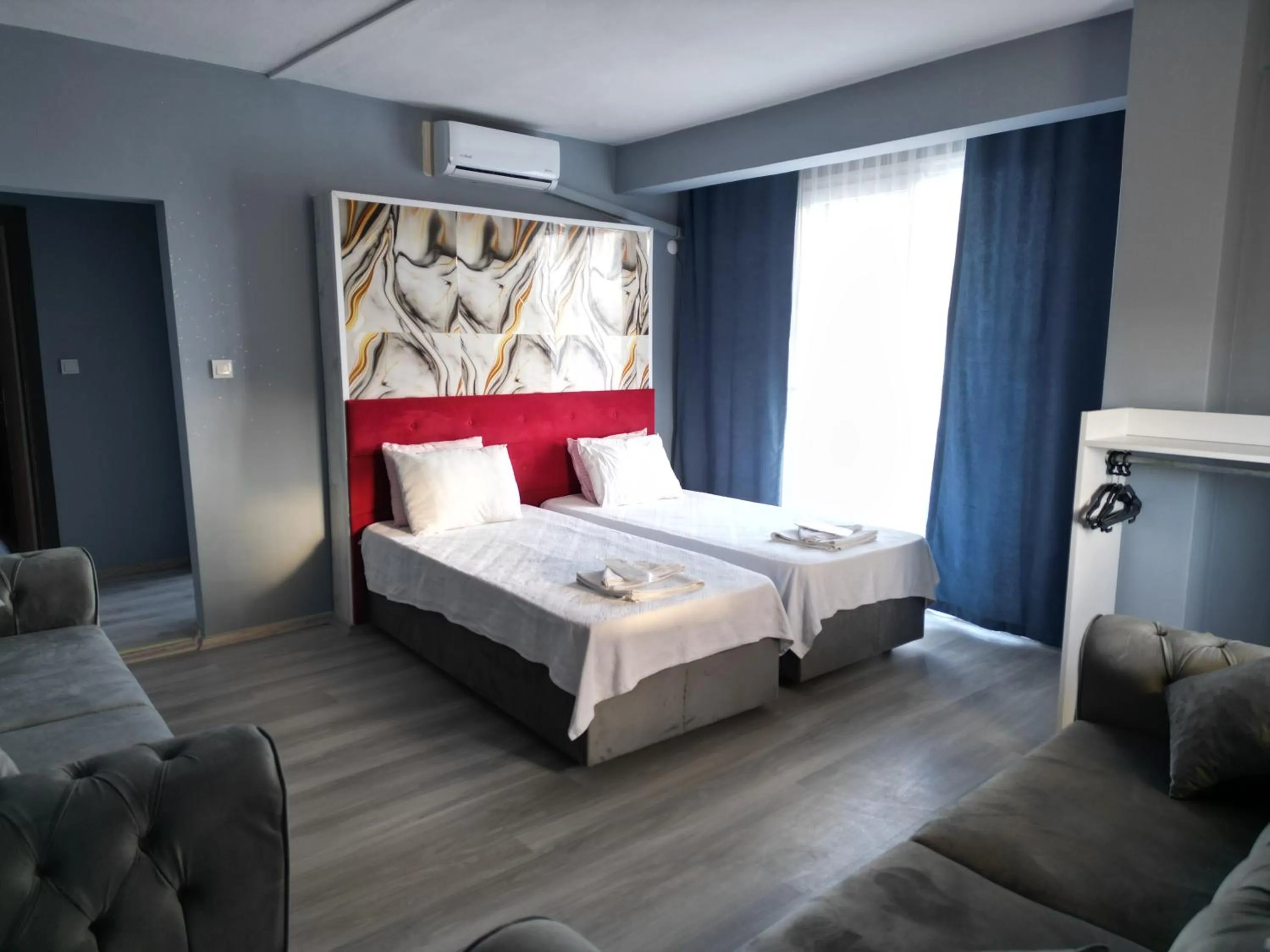 Seating area, Bed in Akman City Hotel