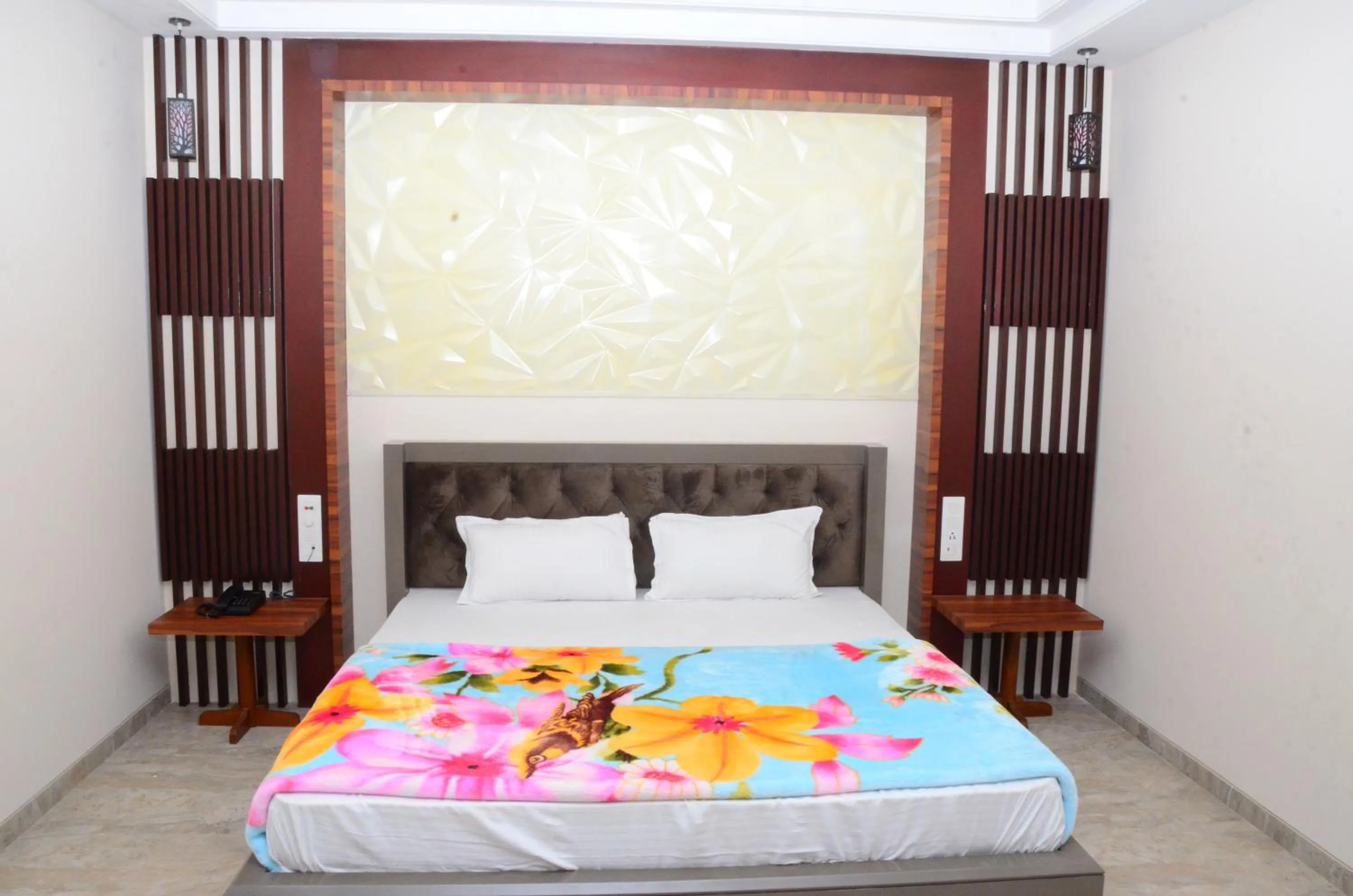 Bed in DUDI HOTEL