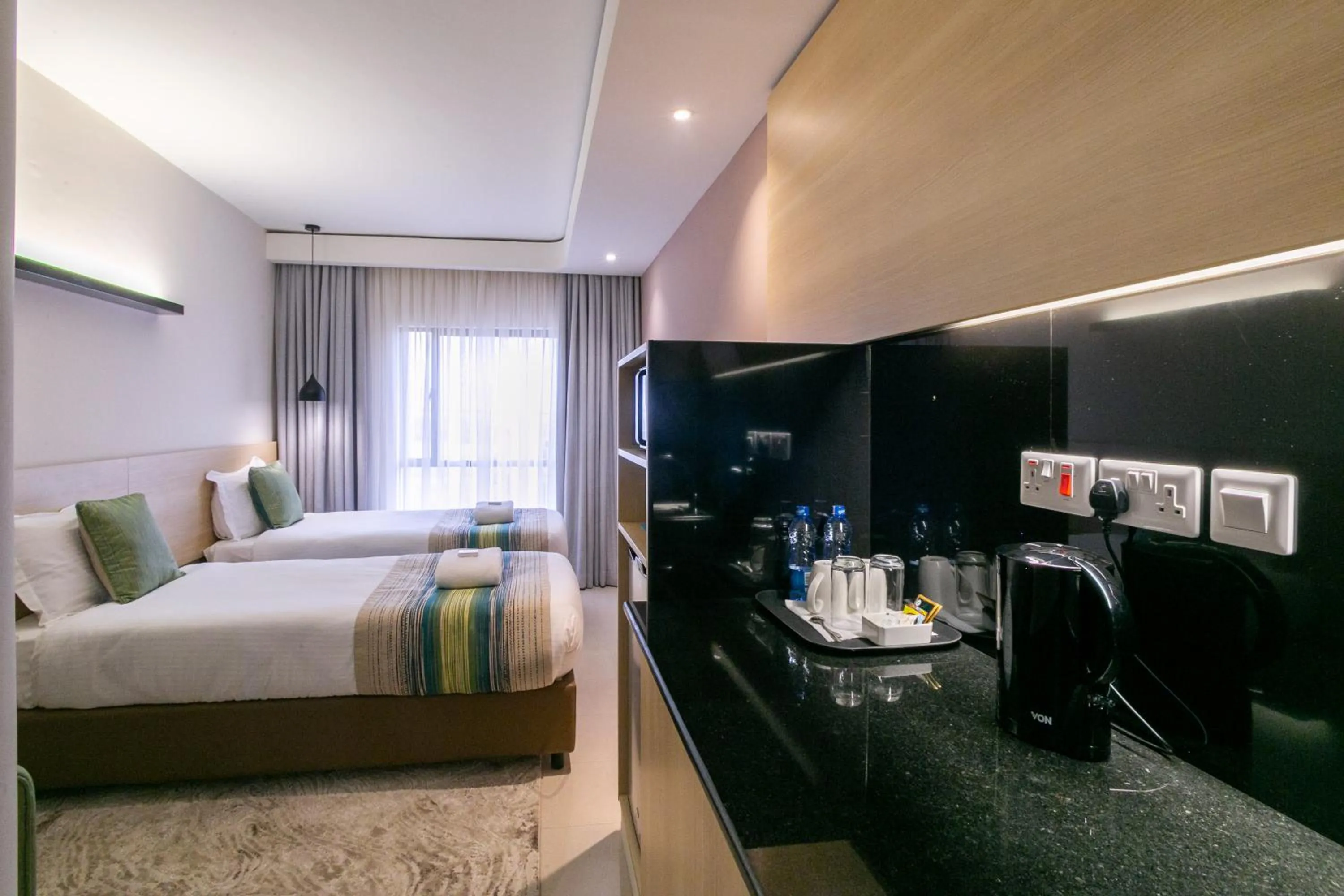 Photo of the whole room, Bed in Kozi Suites Nairobi Airport