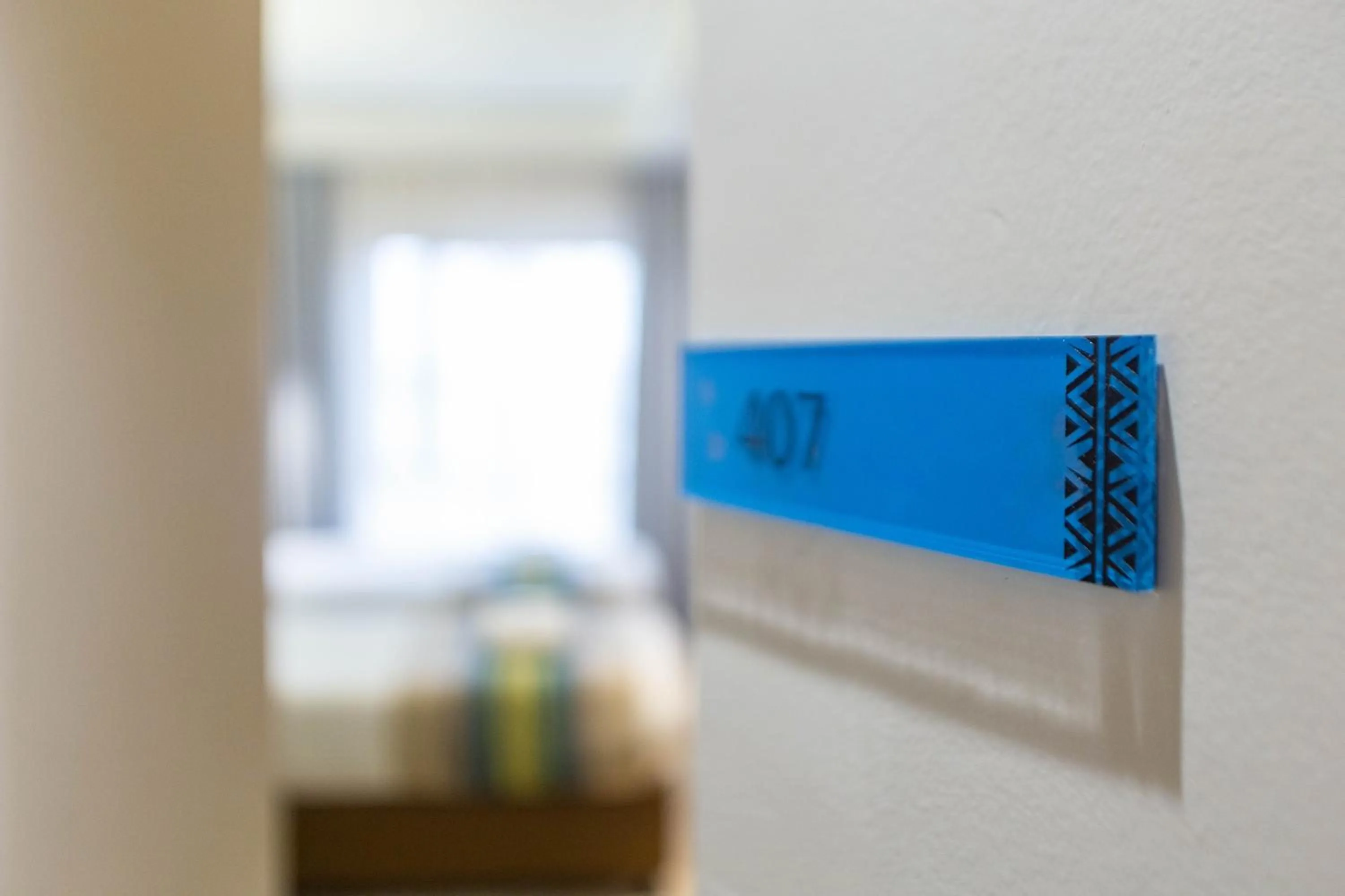 Property logo or sign, Bed in Kozi Suites Nairobi Airport