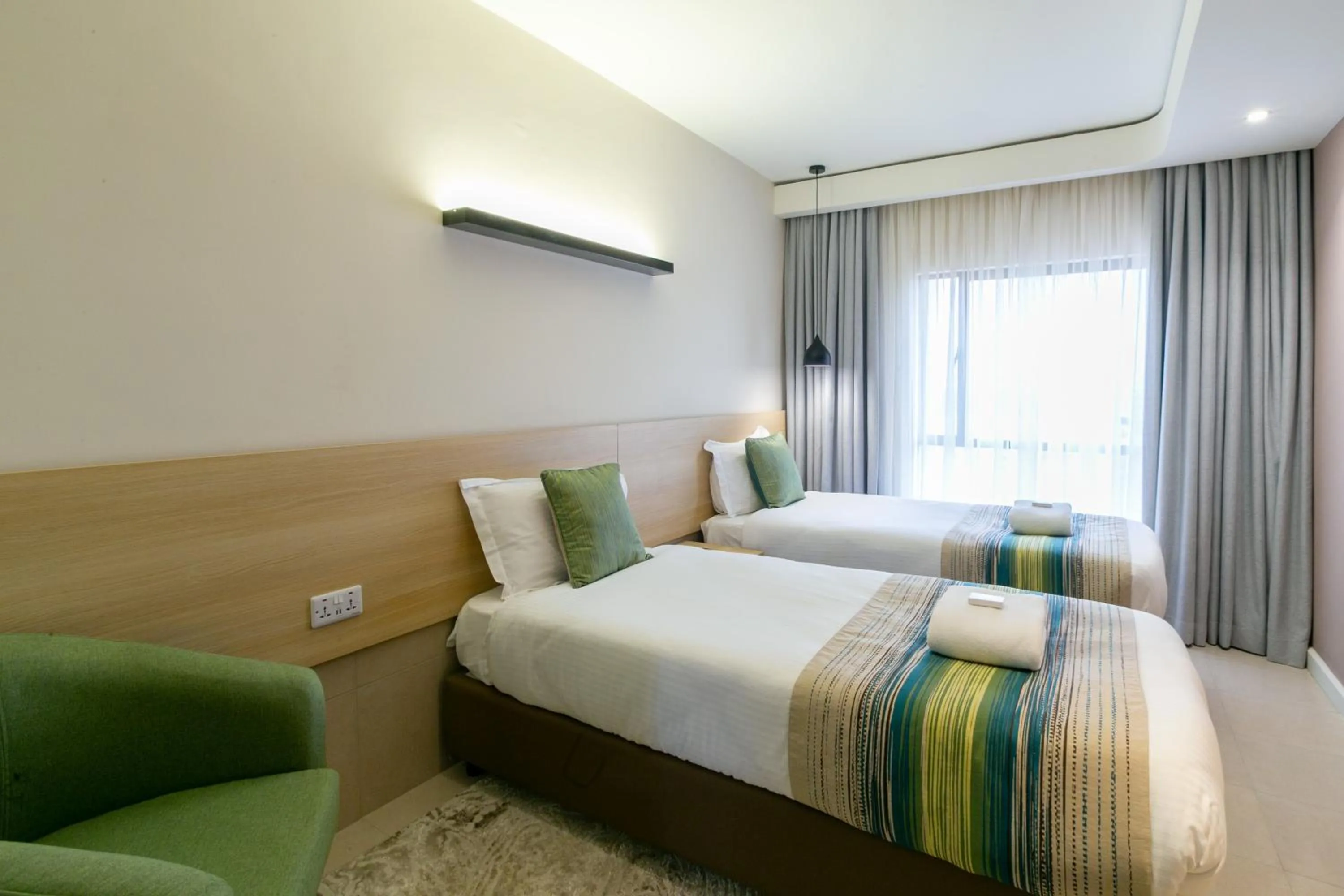 Photo of the whole room, Bed in Kozi Suites Nairobi Airport