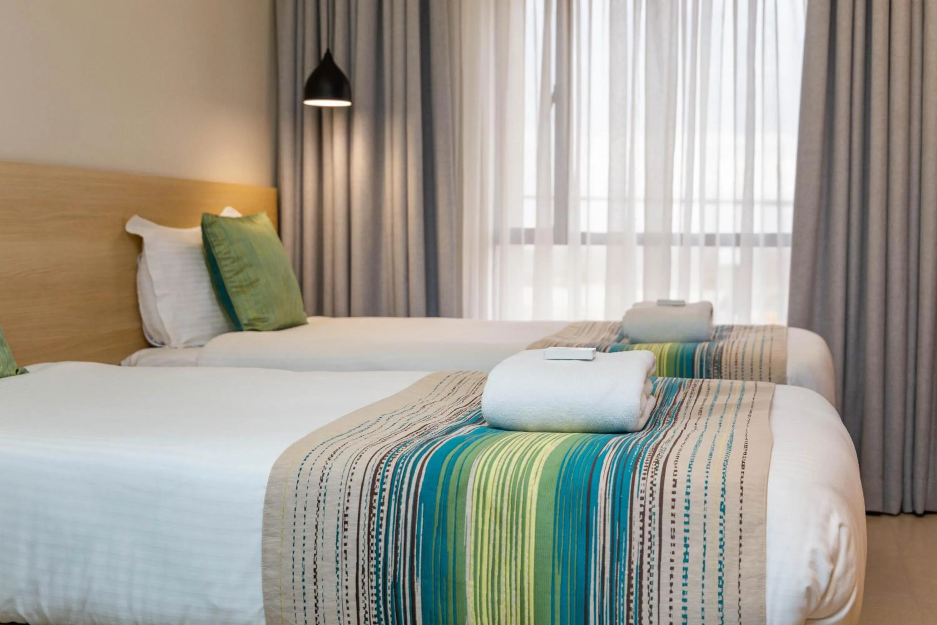 Photo of the whole room, Bed in Kozi Suites Nairobi Airport