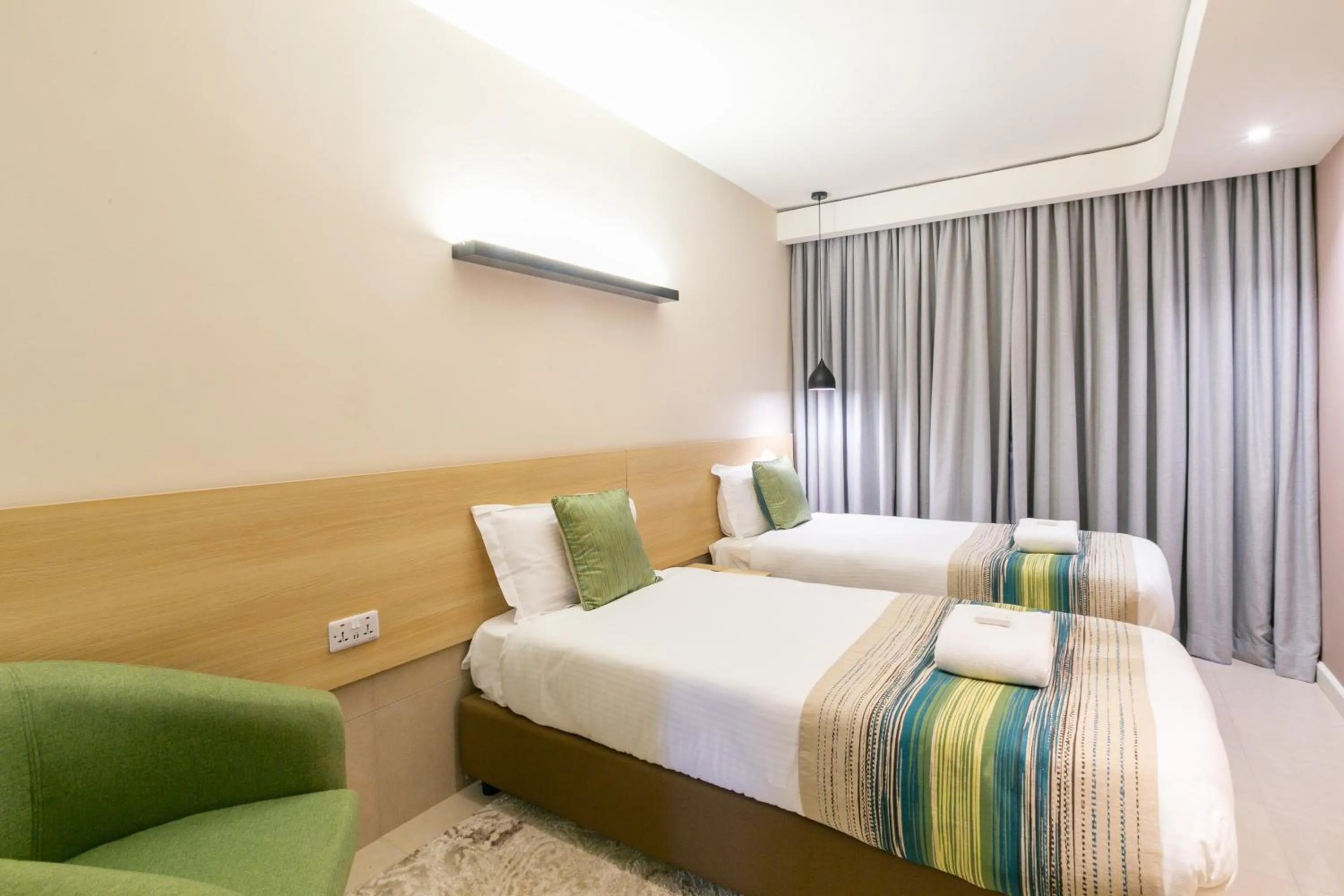 Photo of the whole room, Bed in Kozi Suites Nairobi Airport