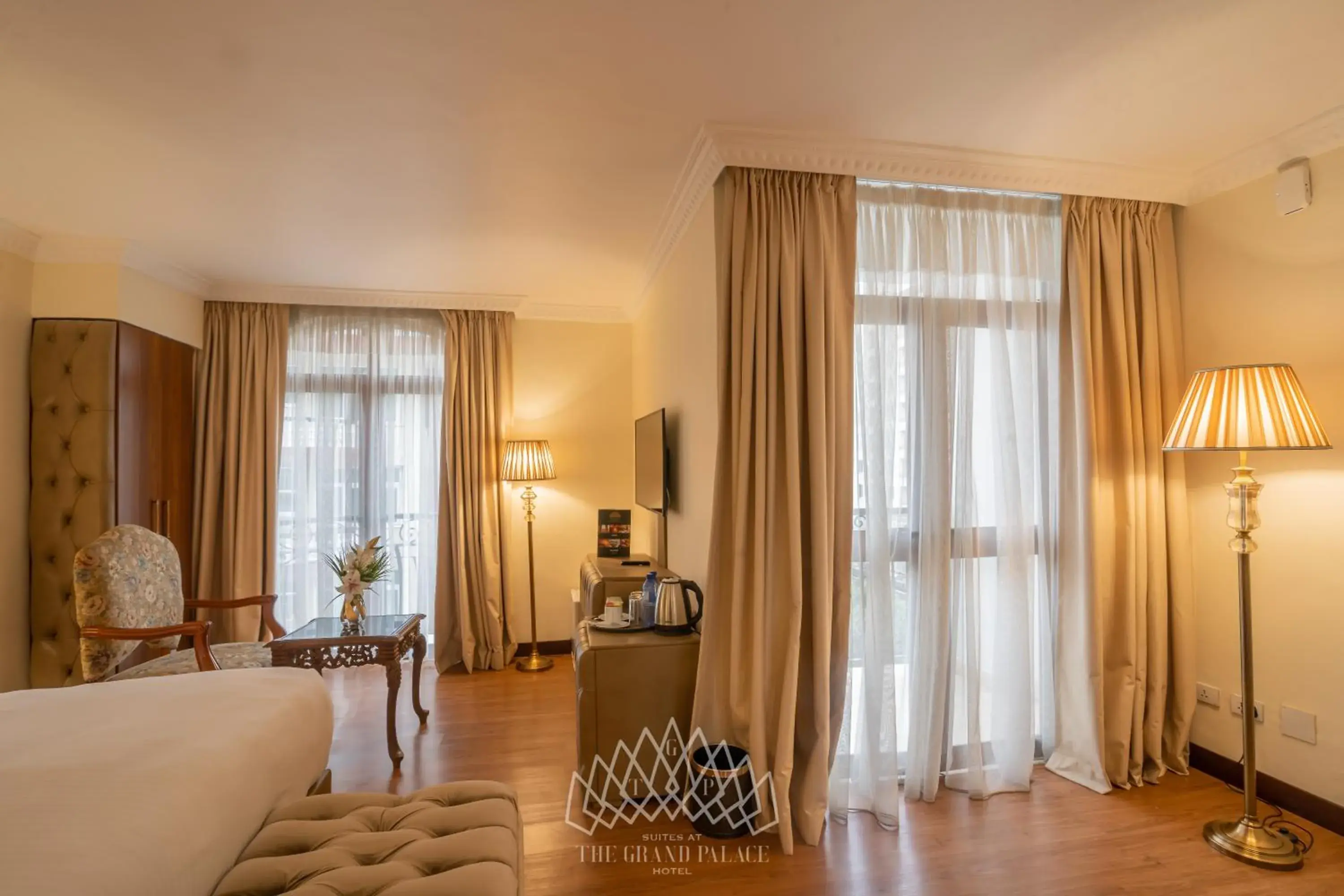 Seating area, Bed in The Grand Palace Hotel Seating area, Bed in The Grand Palace Hotel