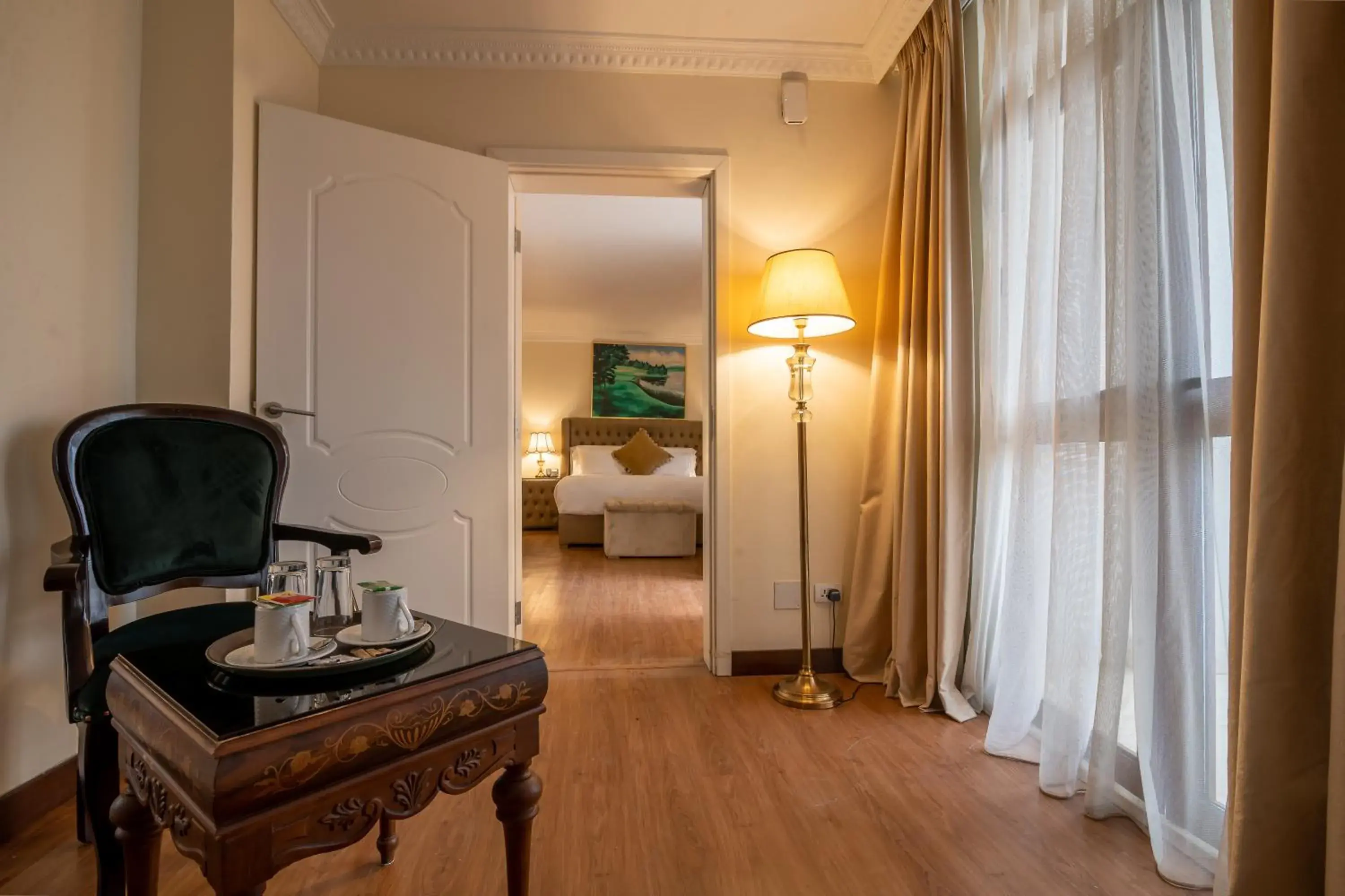 Seating area, Bed in The Grand Palace Hotel Seating area, Bed in The Grand Palace Hotel