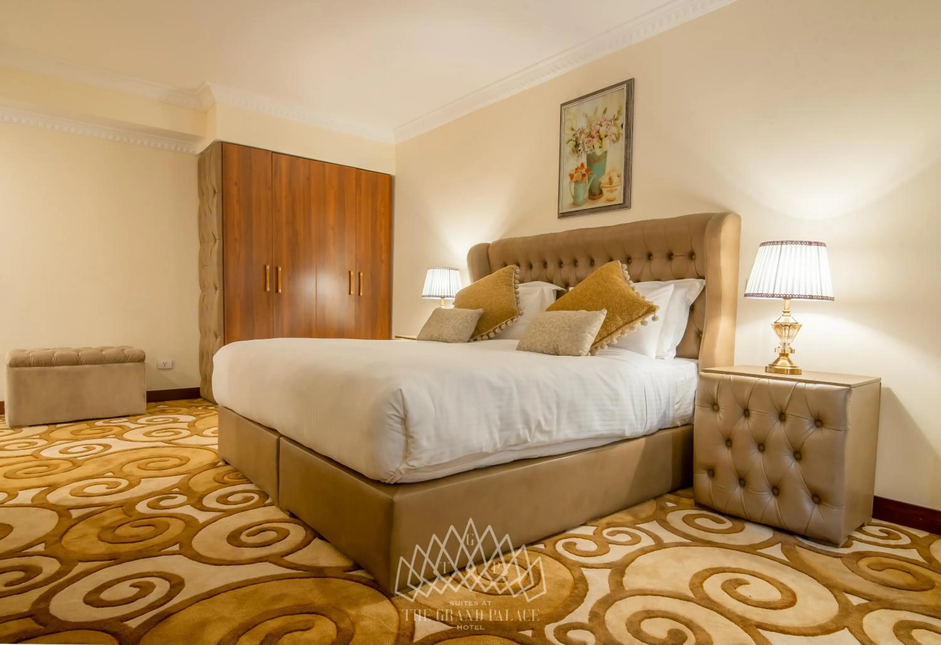 Bed in The Grand Palace Hotel